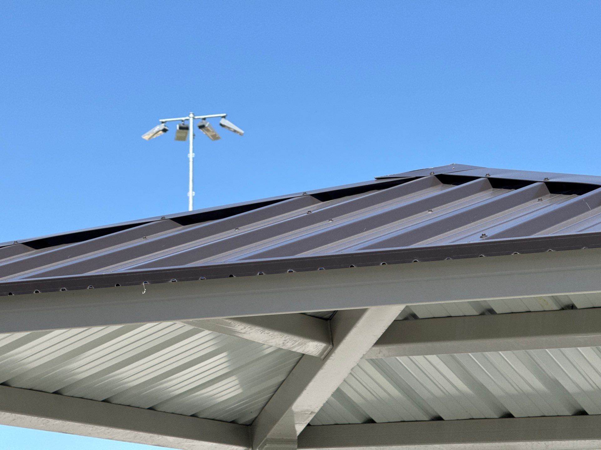 Dark Bronze Exposed Fastener by Reimagine Roofing