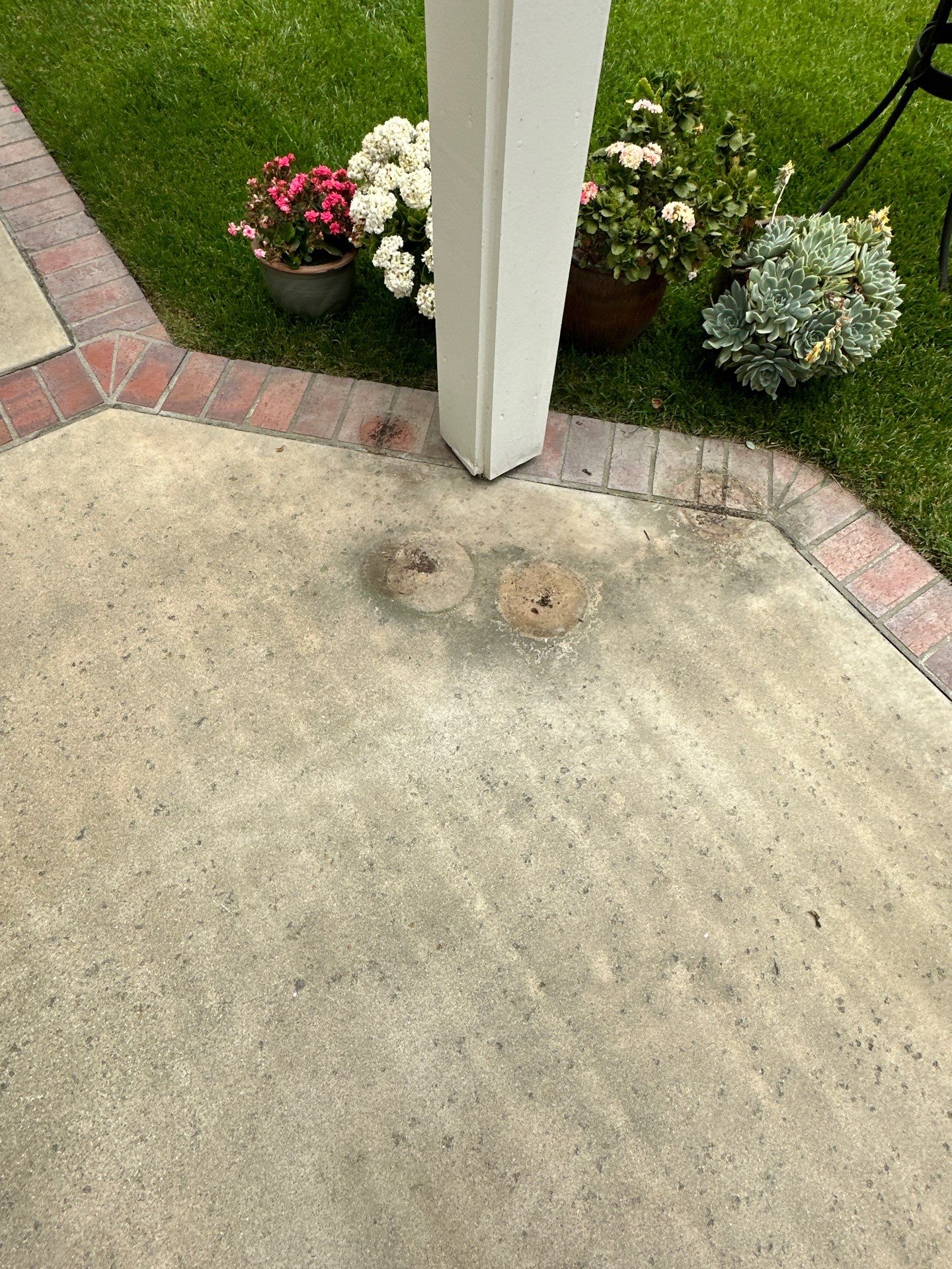 Surface cleaning pressure washing in Orange County on patio, walkways, and driveway by Property Cleaning Experts, LLC
