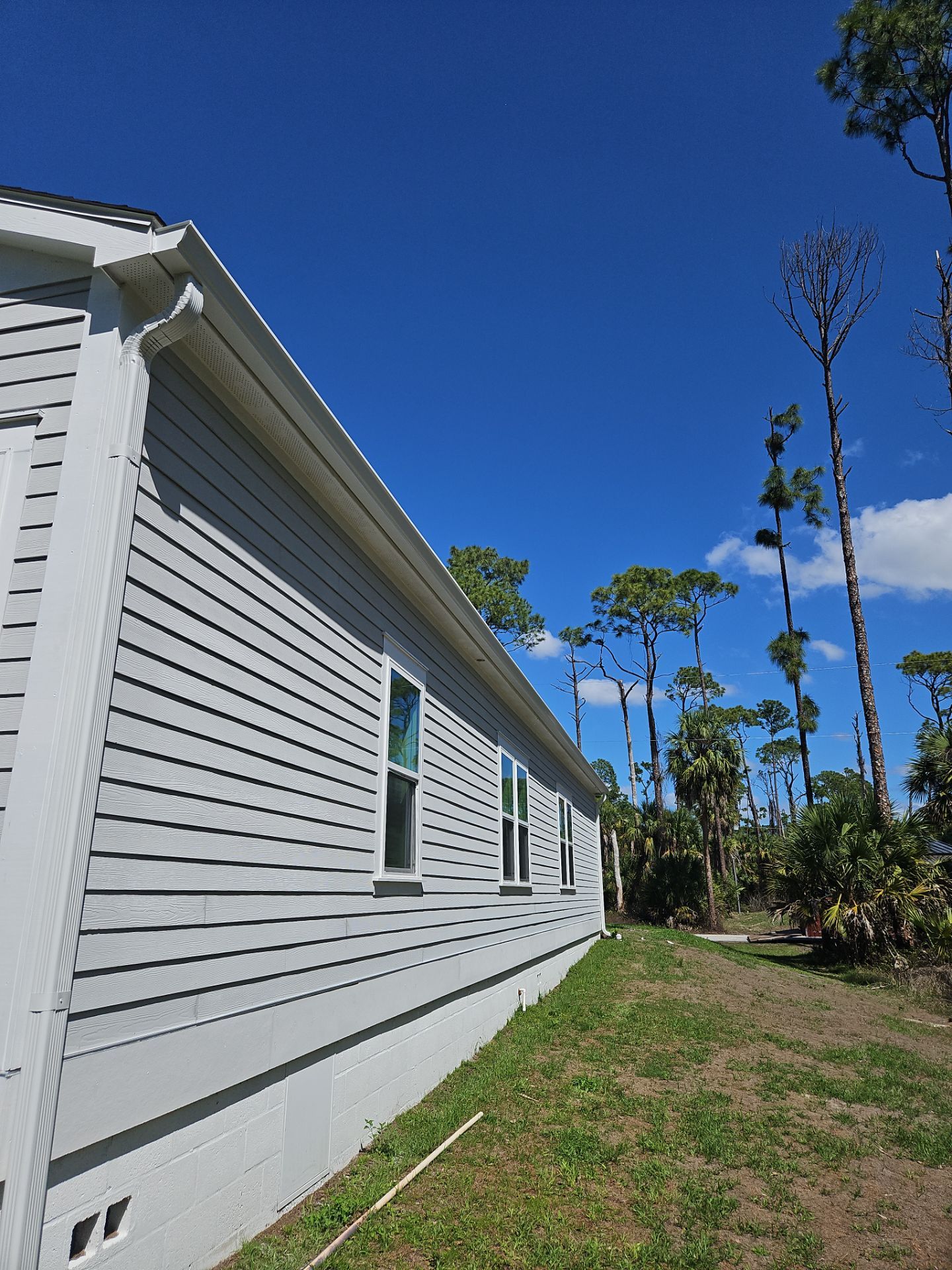 Downspout Installation using 3X4 Elbow Downspout in Port Charlotte FL by Gutter Professors