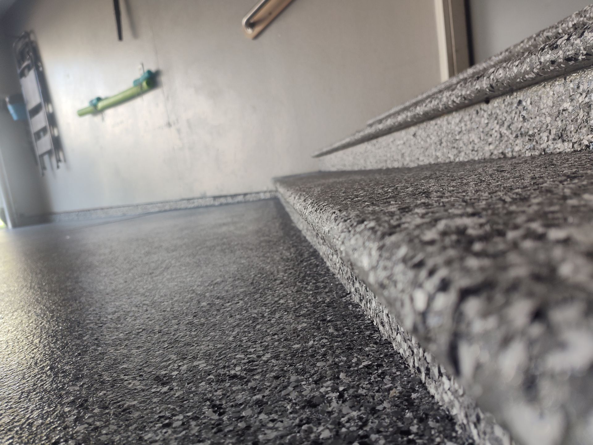 Close Up View of This Customer's New Flake Coating by Revival Concrete Coatings