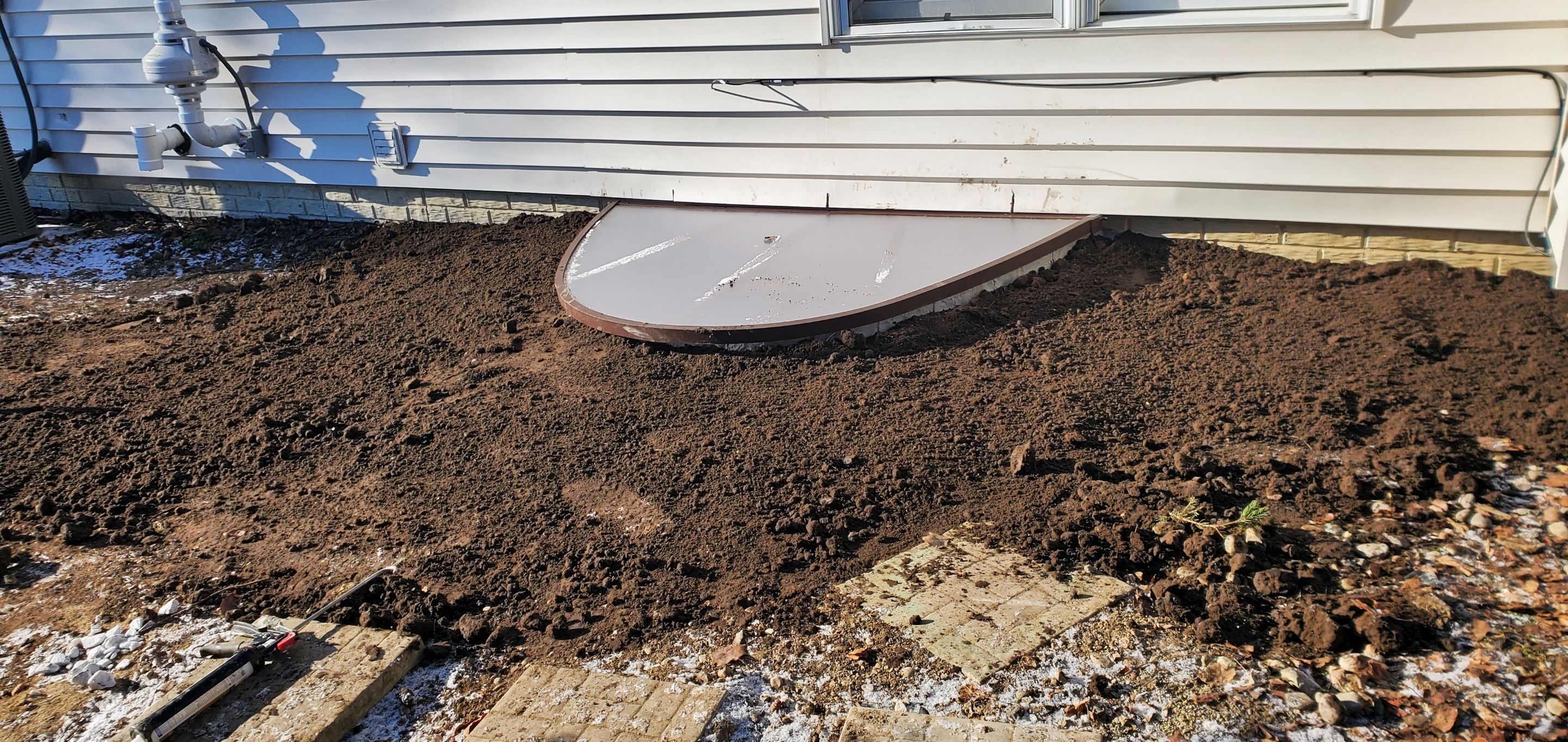 Egress Window Installation using Rockwell Egress Fiberglass Egress Window Well by Toledo Basement Repair 