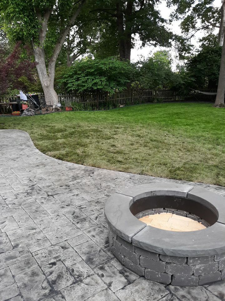 Back Yard Stamped Patio by LAND ESCAPES LLC