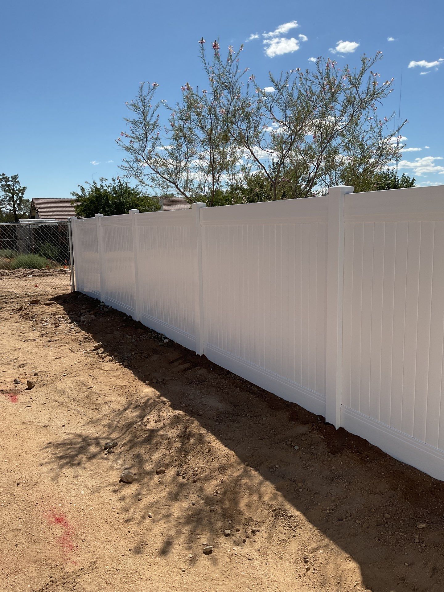 6ft White Privacy Vinyl Fence with Chain-link Fence by Fence Guys Inc.
