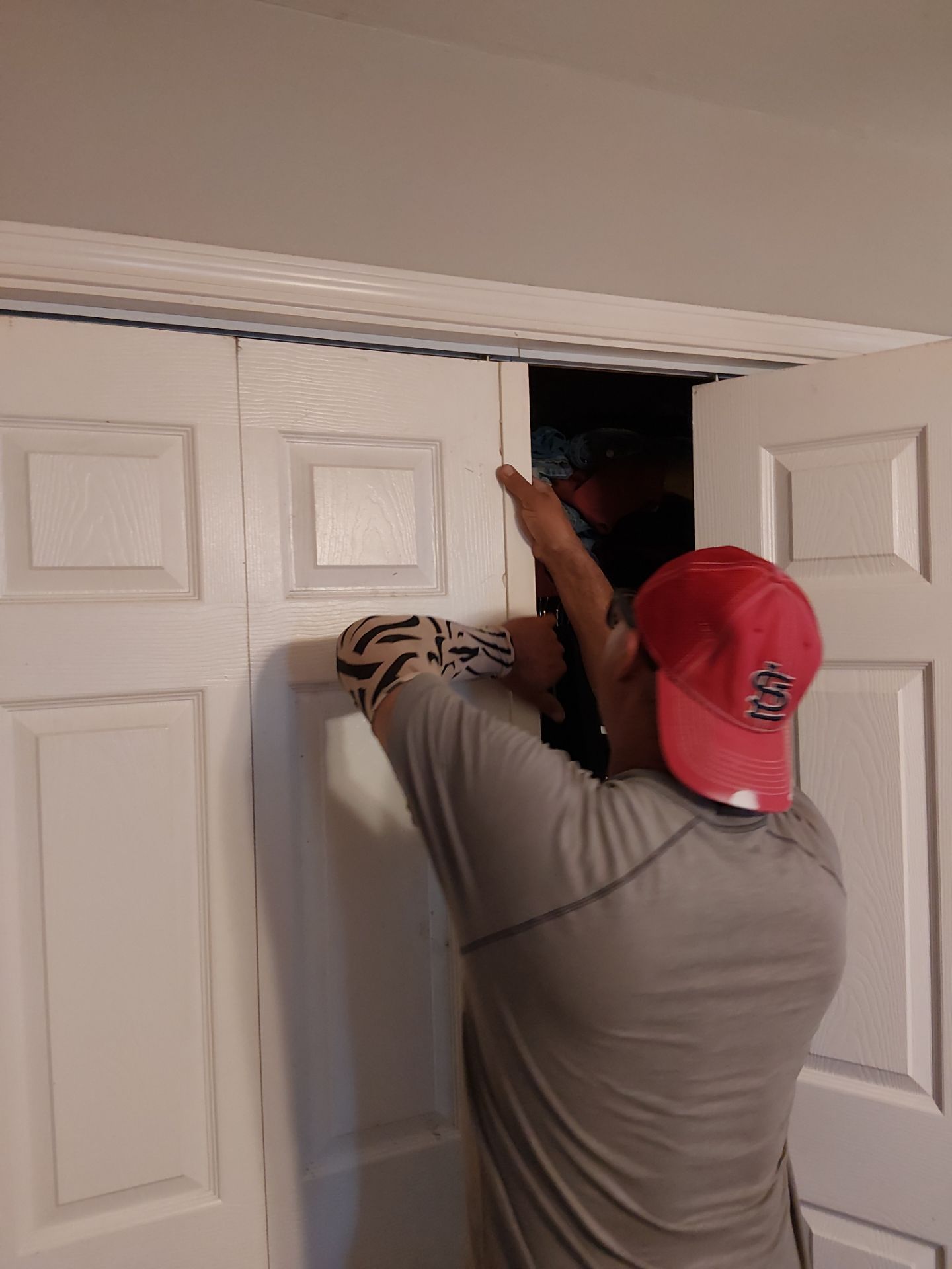 White Paneled Bifold Closet Door Installation by Legendary Services Company LLC.