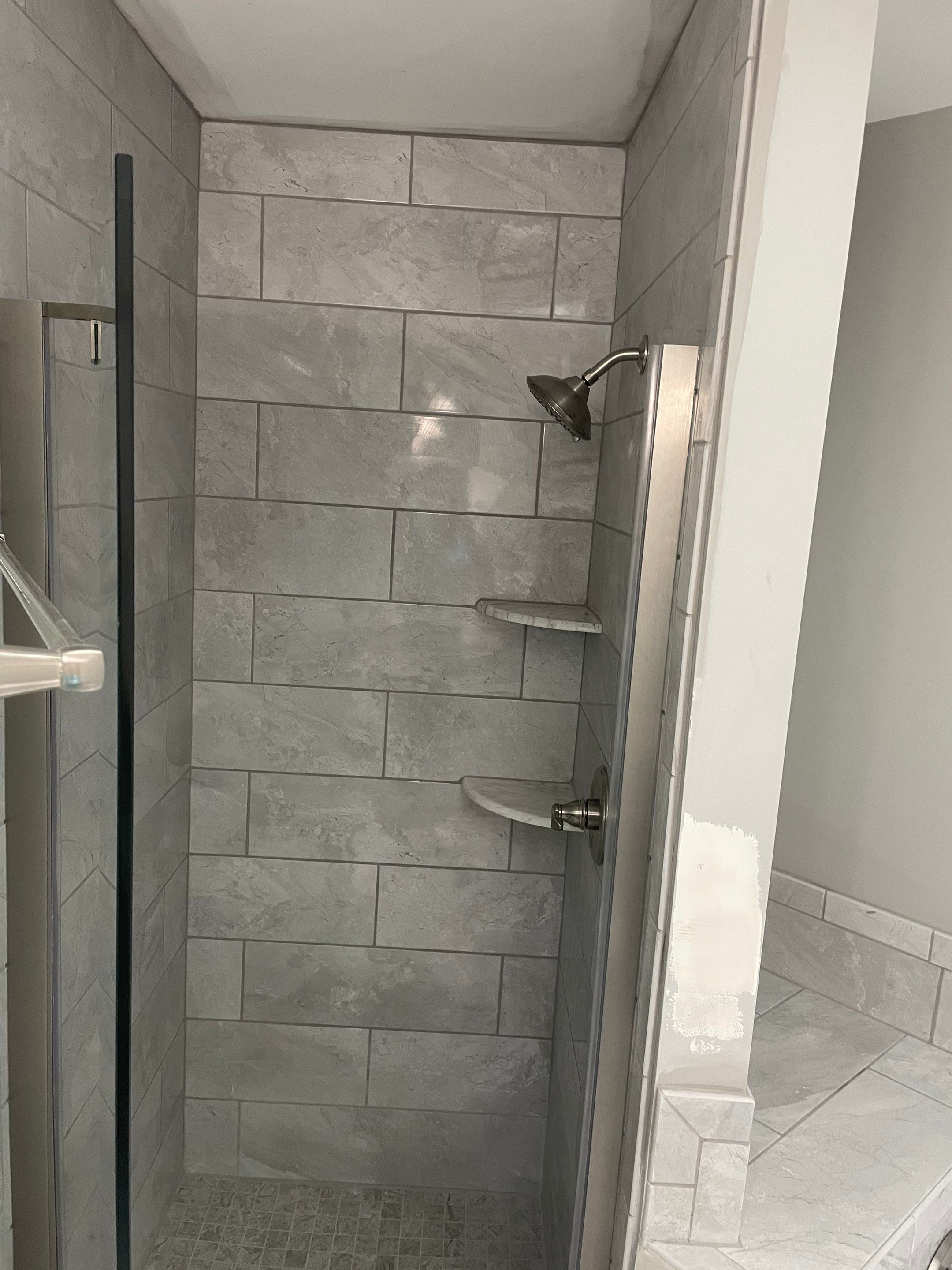 Bathroom Remodel using Tile by Home Concepts Construction