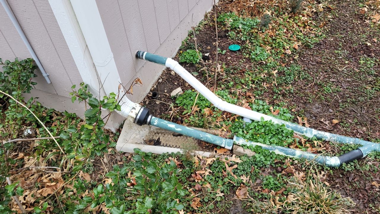 Drainage and Downspout Installation by LAND ESCAPES LLC