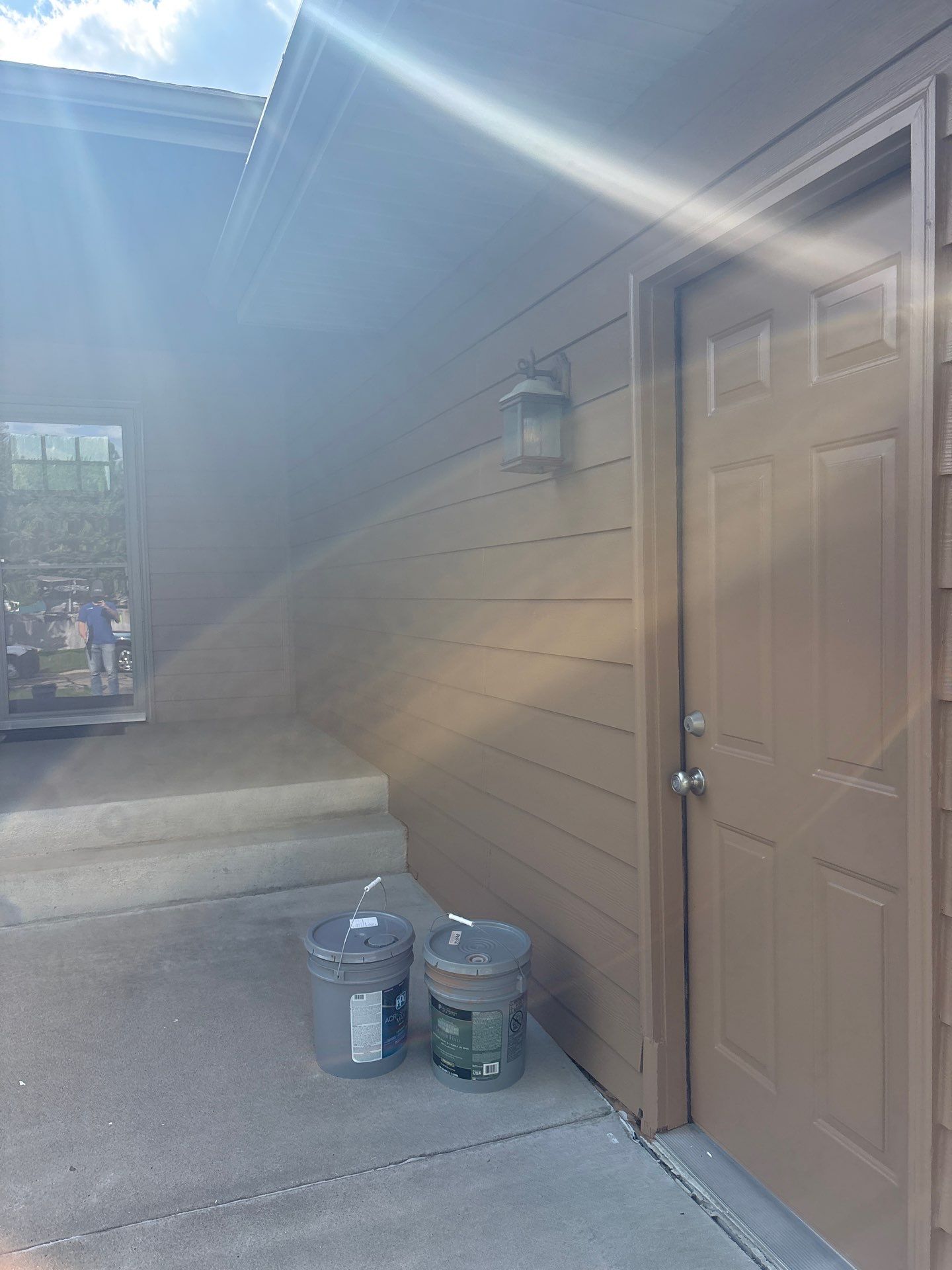 Sioux Falls Residential Exterior Door and Siding Refresh by Select Painting, Coatings & Garage Cabinets