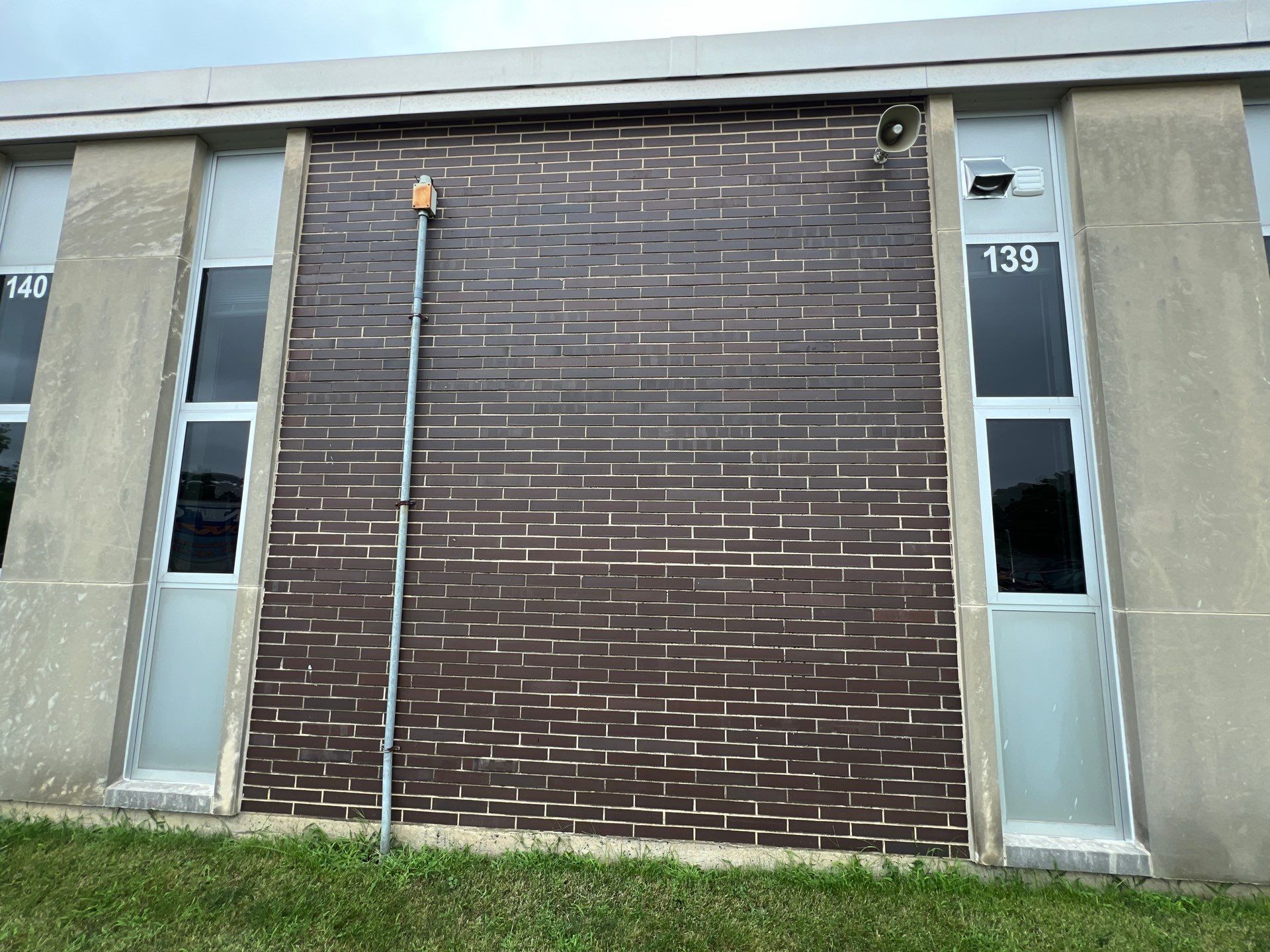 commercial pressure washing using Algaecide, soft wash soap by Northern Power Washing LLC.