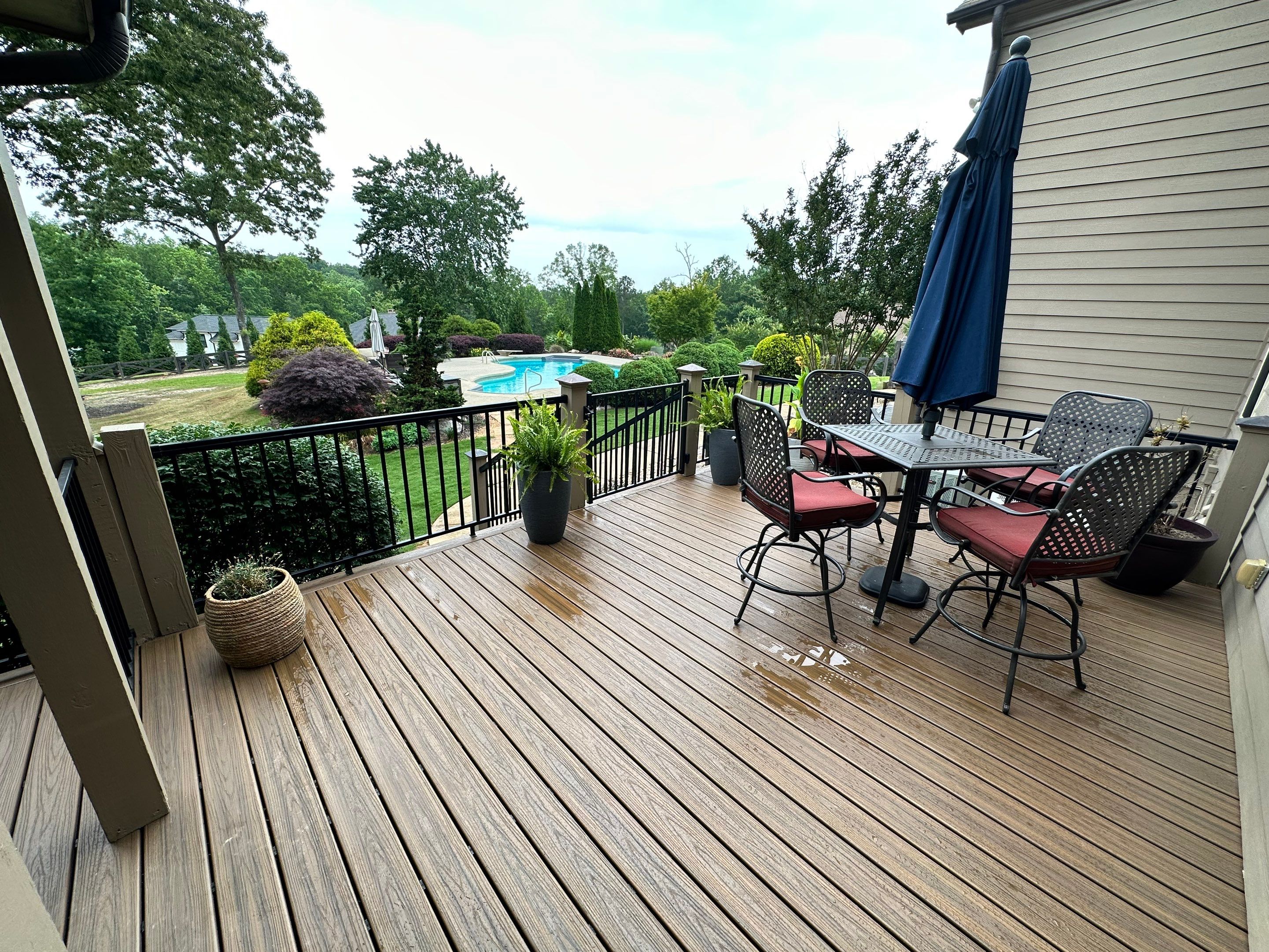 Composite Deck Flooring and Black Metal Railing Replacement in Dallas by Swift Home Renovations