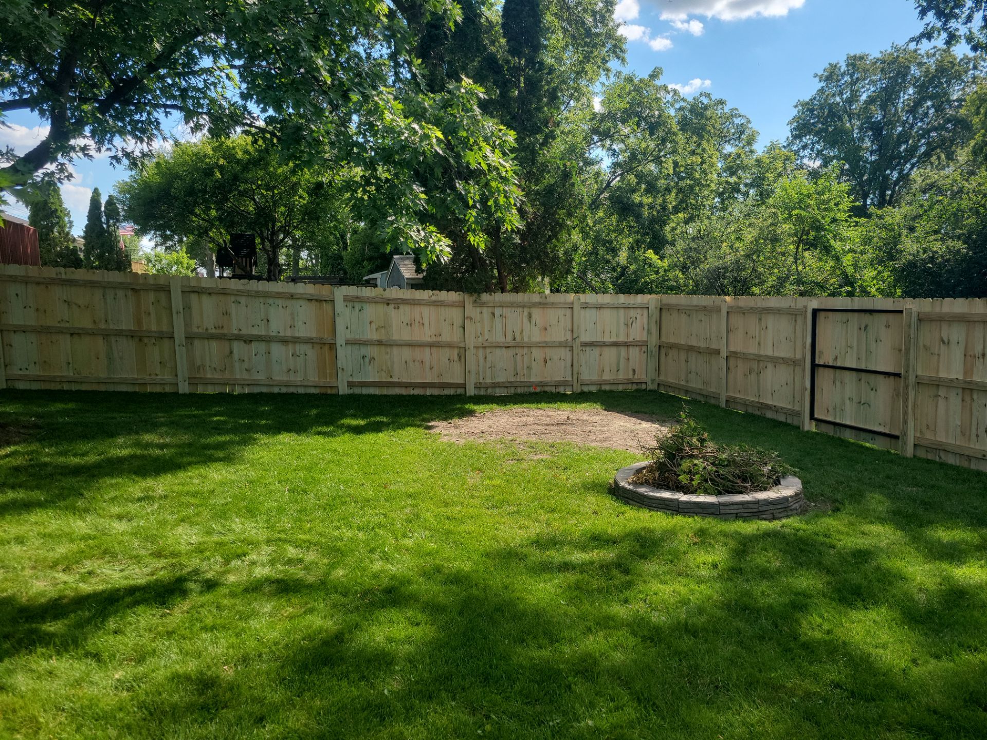 Pressure-Treated Pine Privacy Fence and Custom Gates in Waterloo by Perfect Picket Fence and Stain