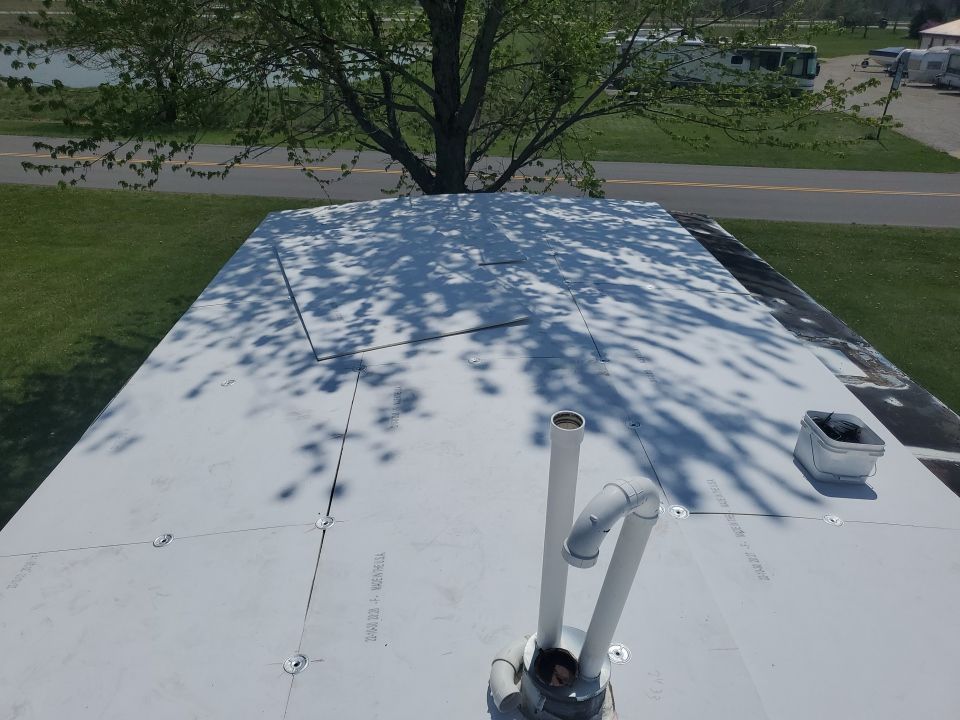 Residential Roofing Installation using 60 mil rubber roof  by Nitro Roofing and Construction