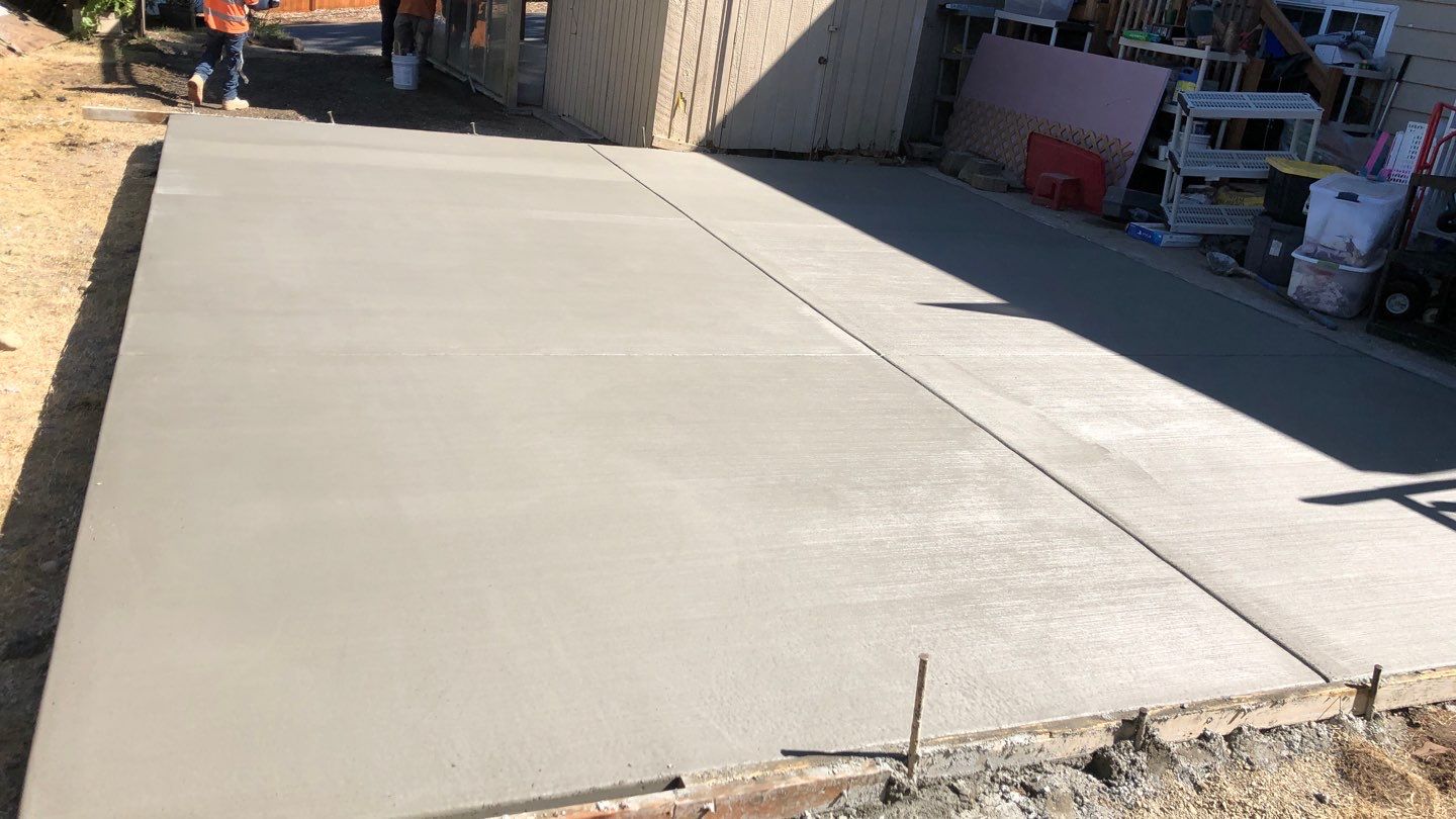 Oscar | Concrete Driveway  by Jireh Asphalt & Concrete Inc 
