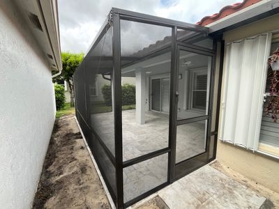 Bronze Aluminum Screen Enclosure and Marble Tile Patio in Boynton Beach