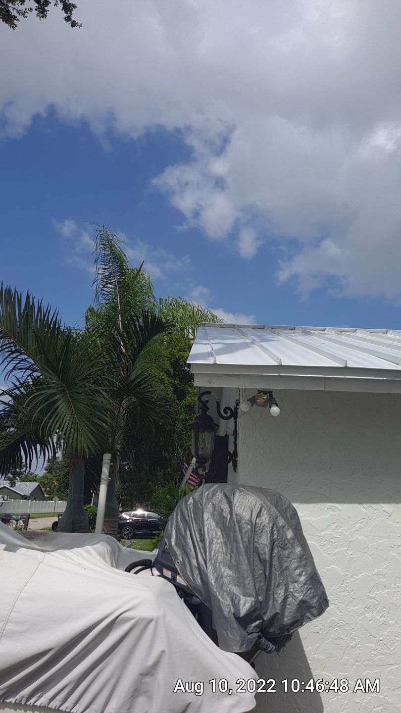 Residential Roofing Installation using 1.5" Nail Strip 24ga Solar White Kynar Coated Standing Seam Metal Panels by Morton Roofing, Inc.