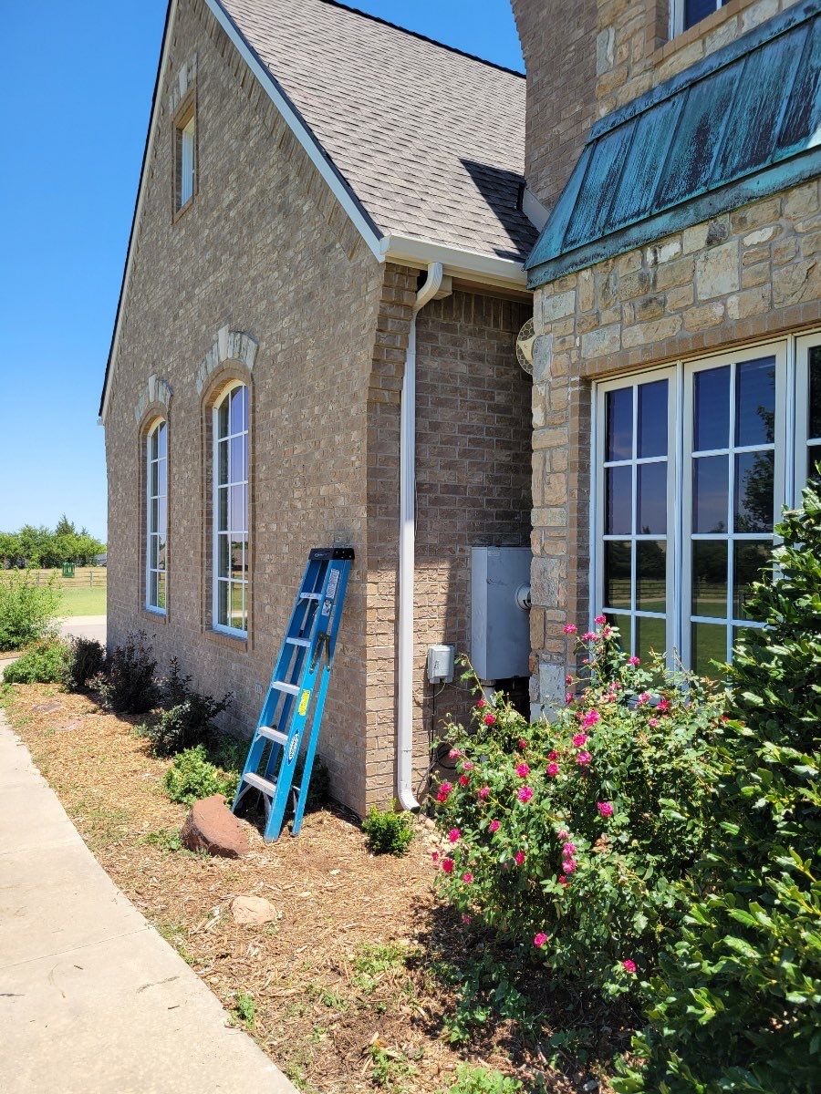 Roof Replacement and Gutter Installation in Edmond, OK by McCann's Roofing and Construction
