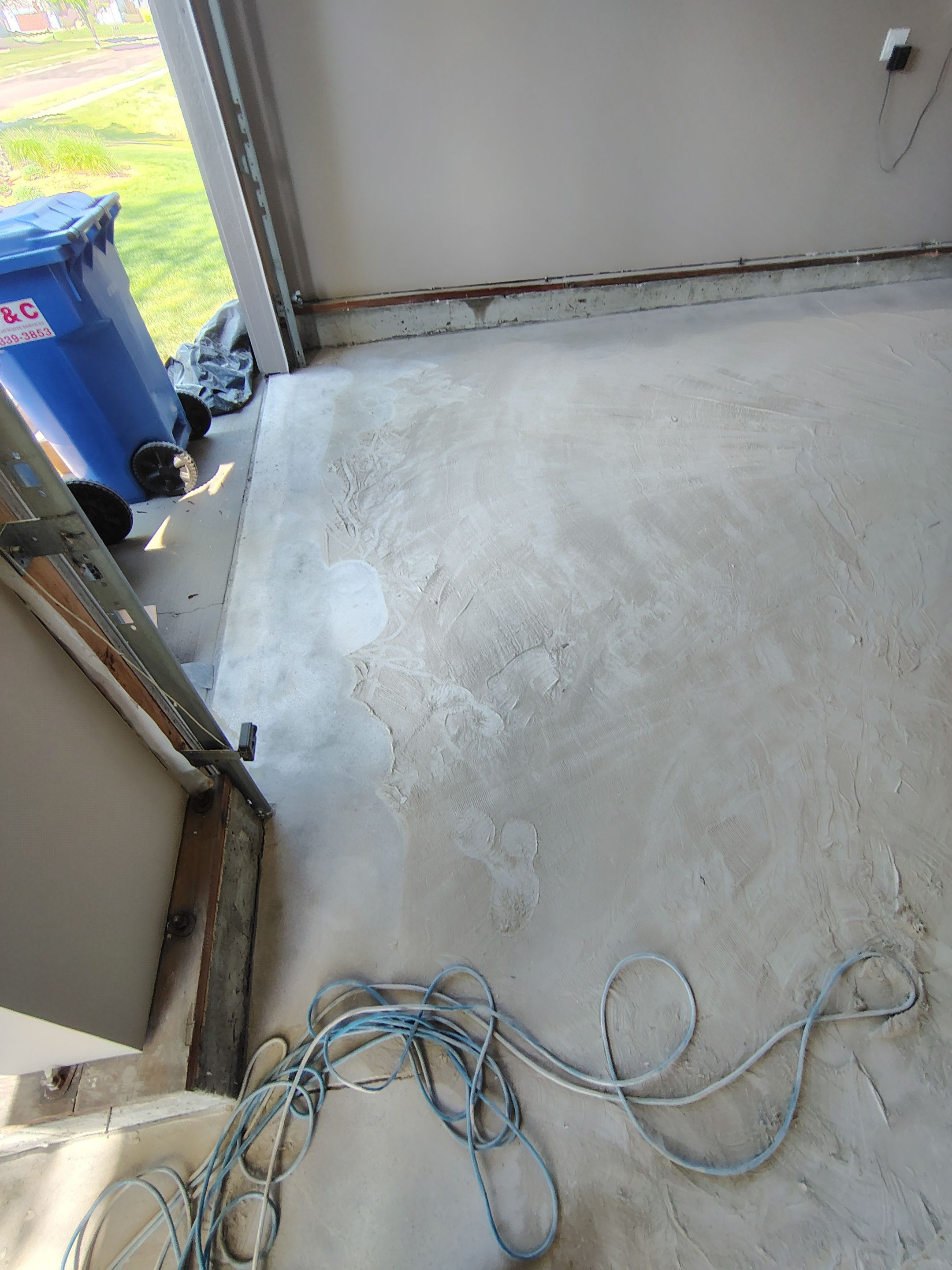 Sioux Falls Garage Concrete Repair and Epoxy Flake Floor Coating by Select Painting, Coatings & Garage Cabinets