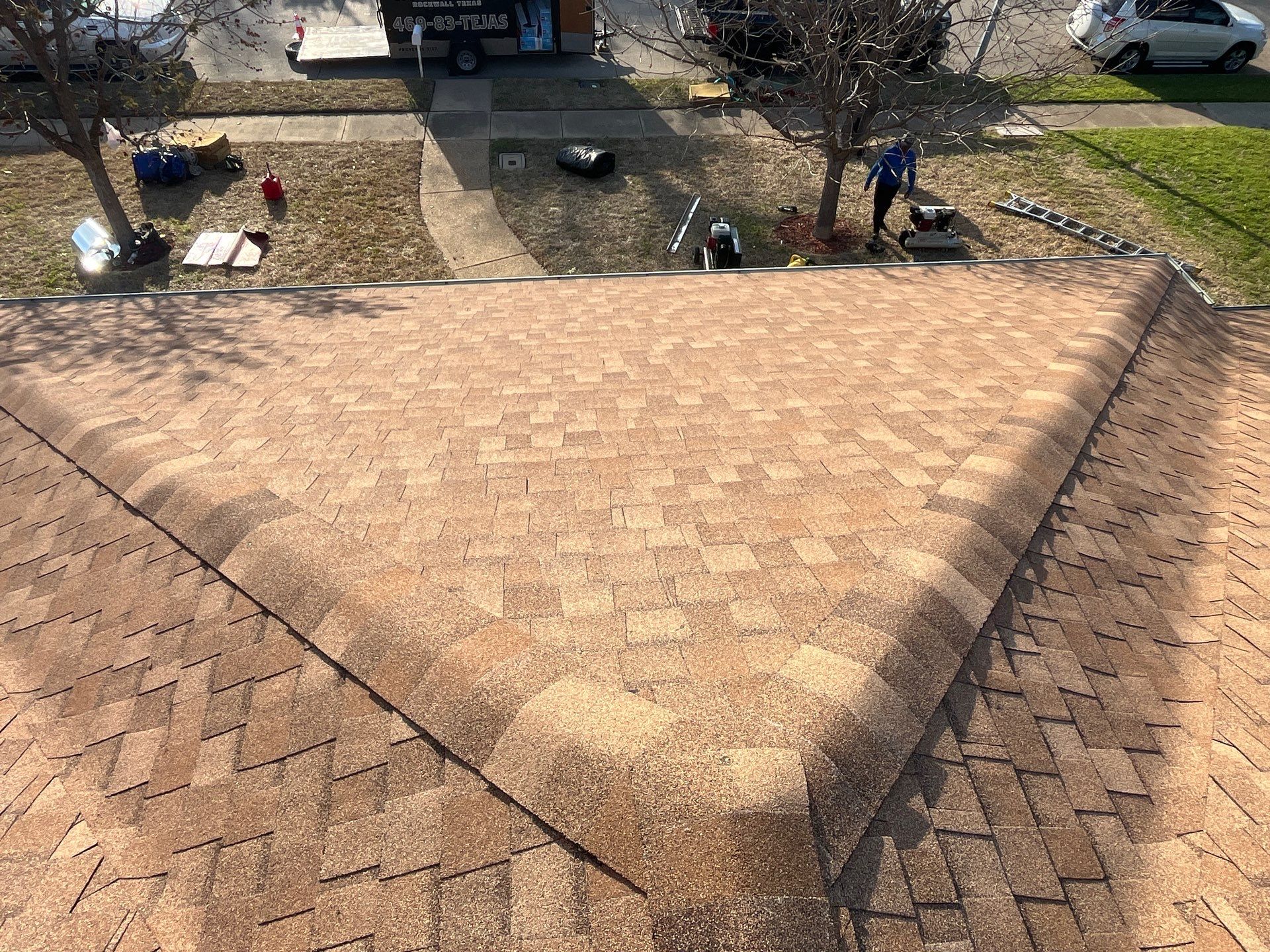 Medium brown brick with Tamko Rustic Cedar by Tejas Roofworks + Restoration