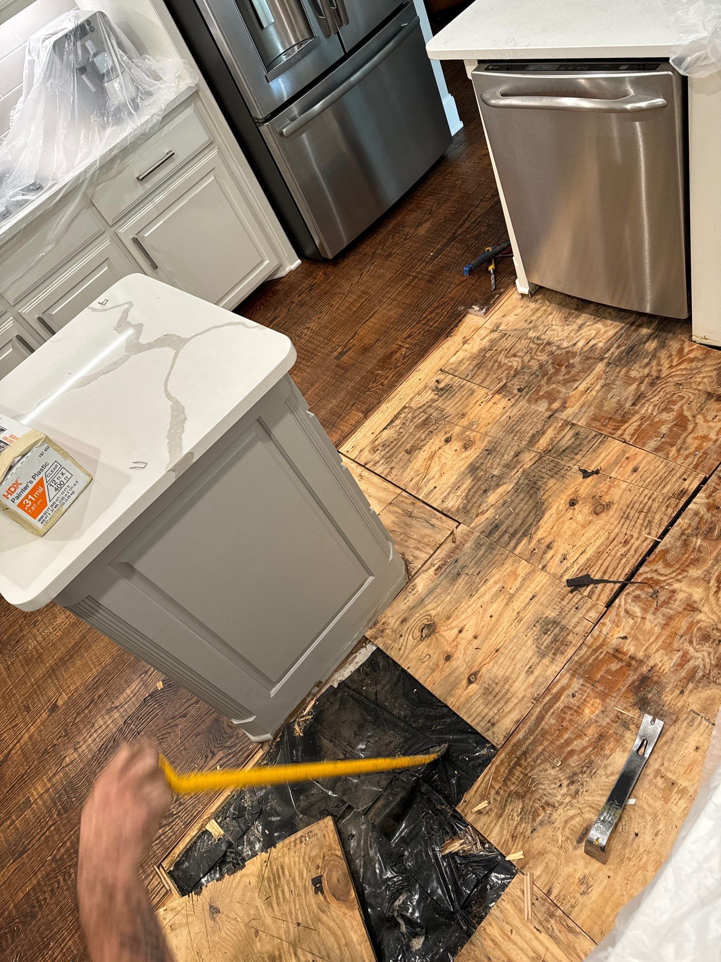 Dishwasher Flood Repair by Fine Line Flooring Inc.