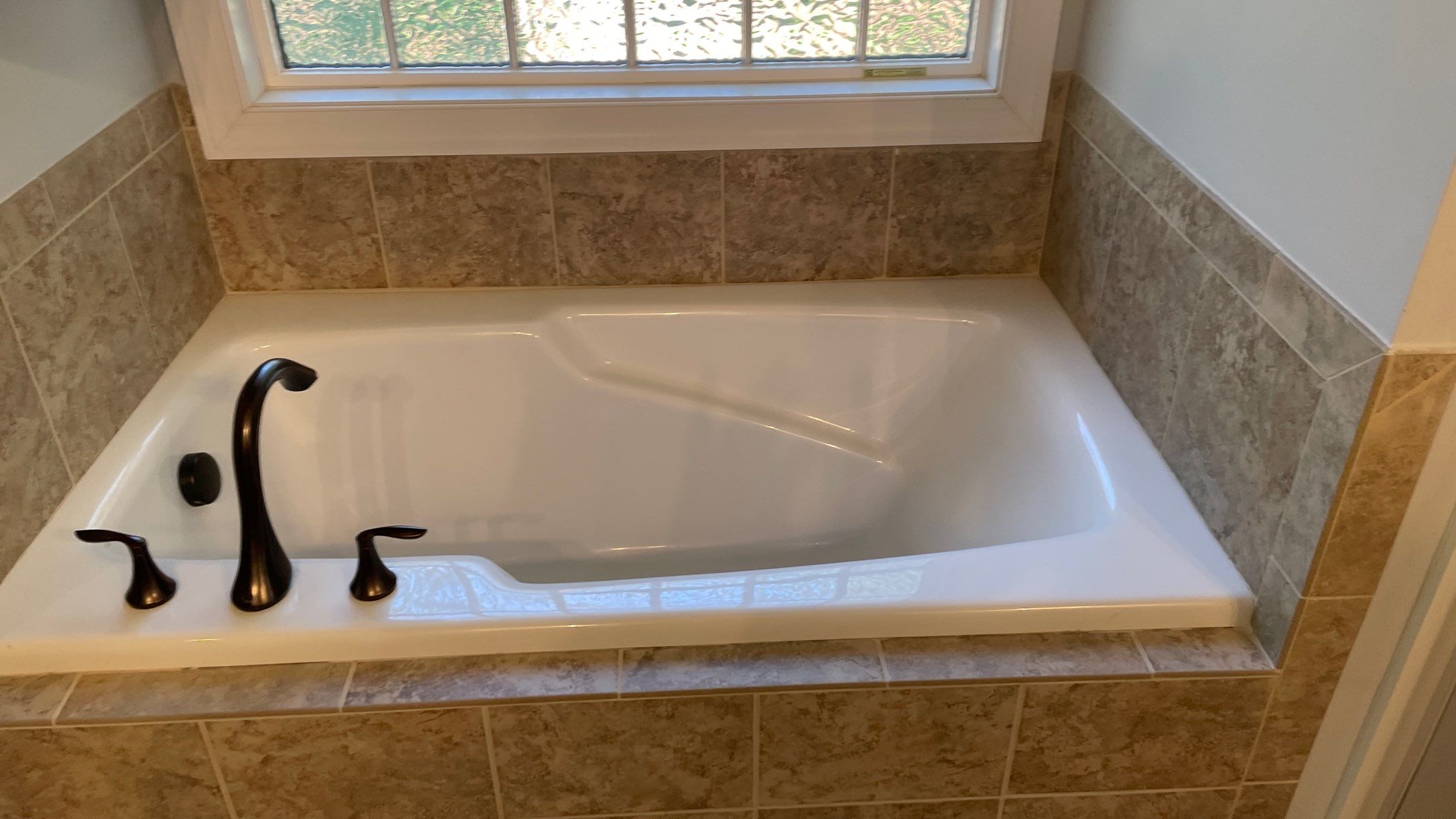 Bright Bathroom Remodel with Wall Removal, Stand Alone Tub and New Vanity by Footprints Floors of Coastal Carolina