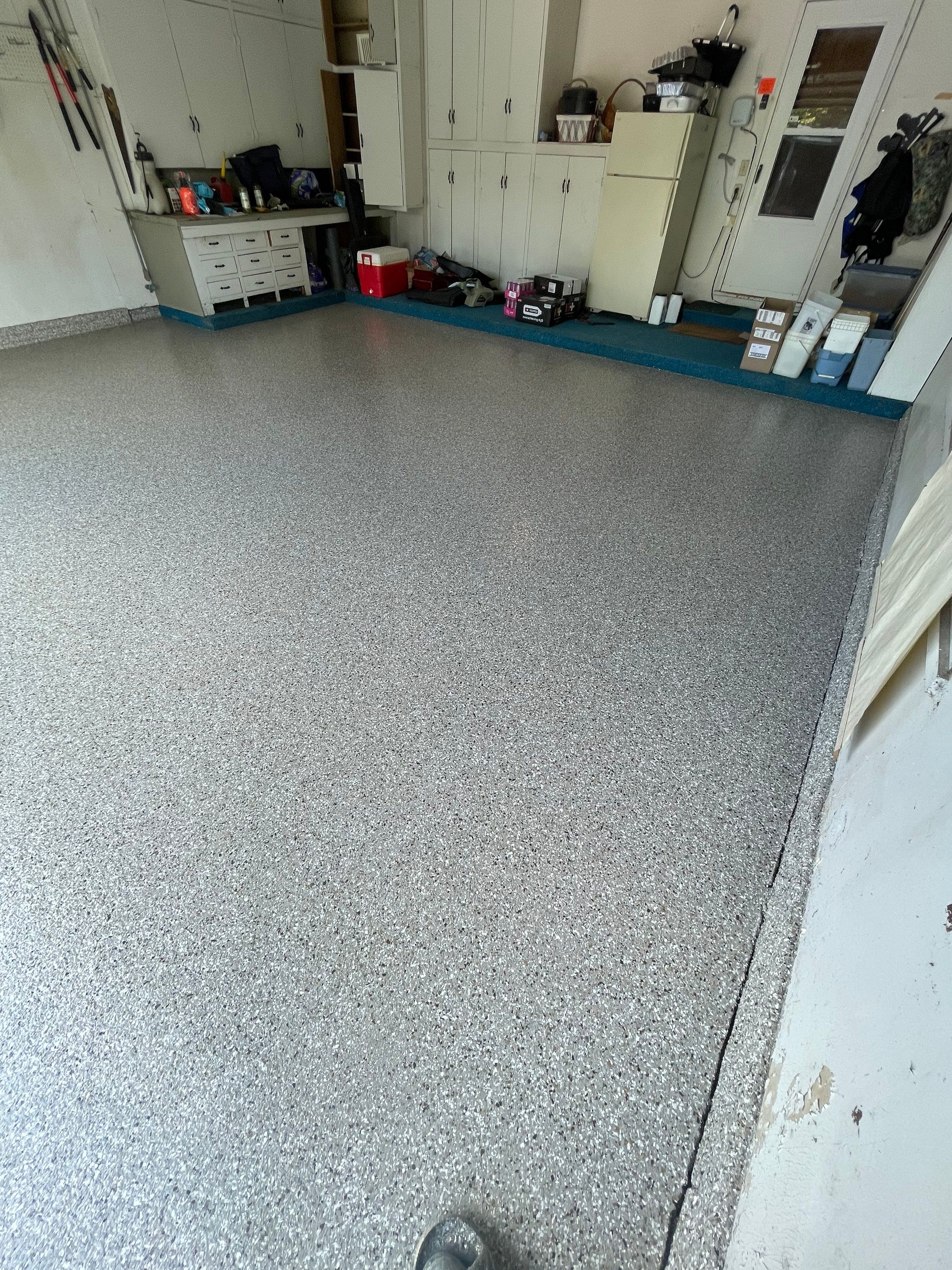 Custom Creekbed Garage Floor Coating in Sioux Falls by Select Painting, Coatings & Garage Cabinets