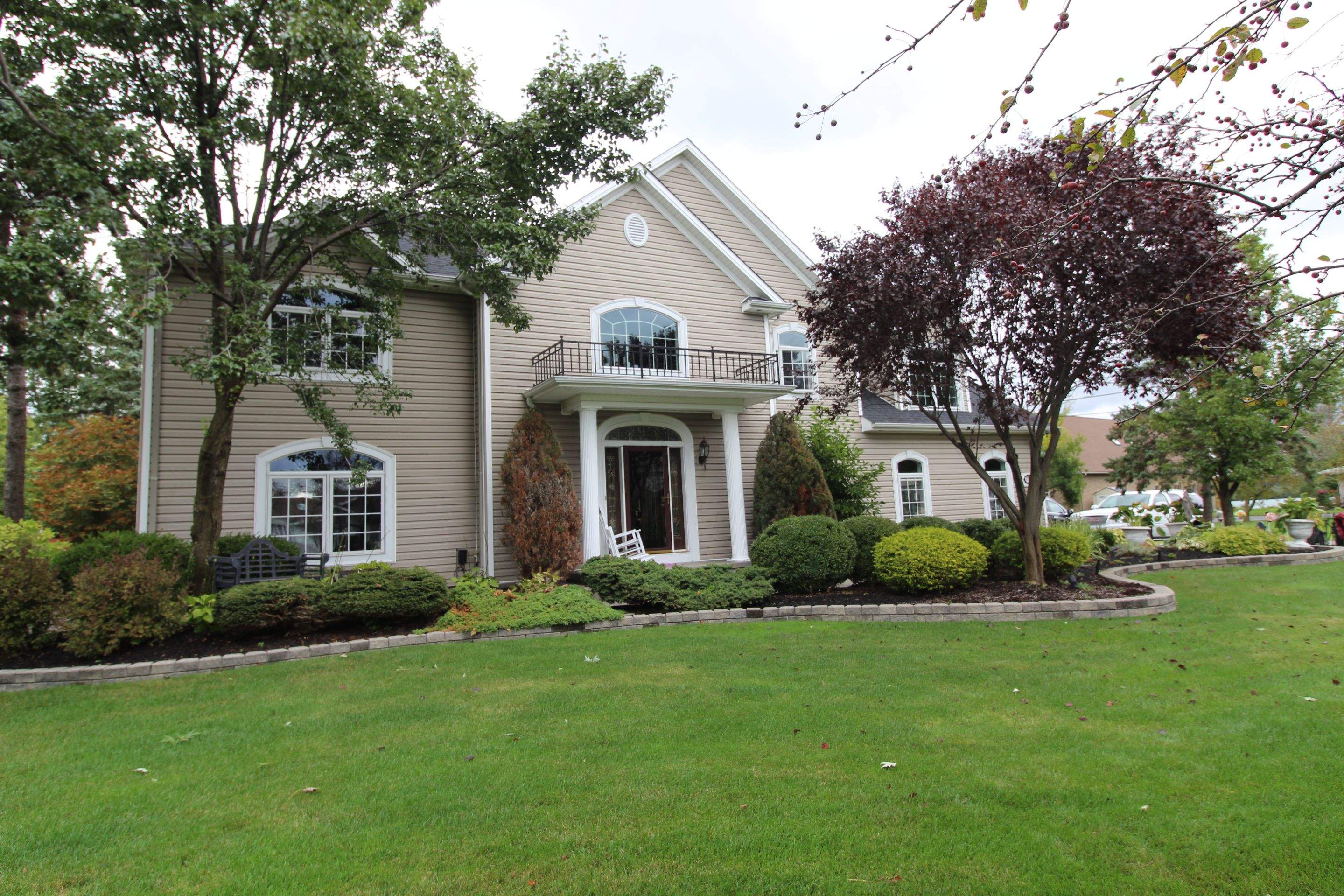 Exterior Renovations- Siding, Concrete, Railings, and Entry Door  by Ivy Lea Construction