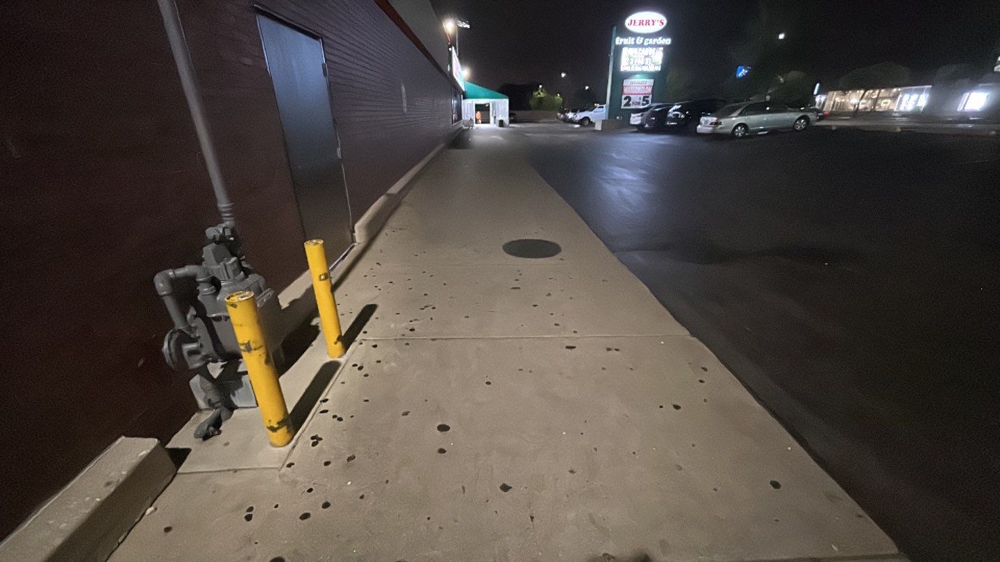 Concrete sidewalk cleaning and degreasing by Northern Power Washing LLC.