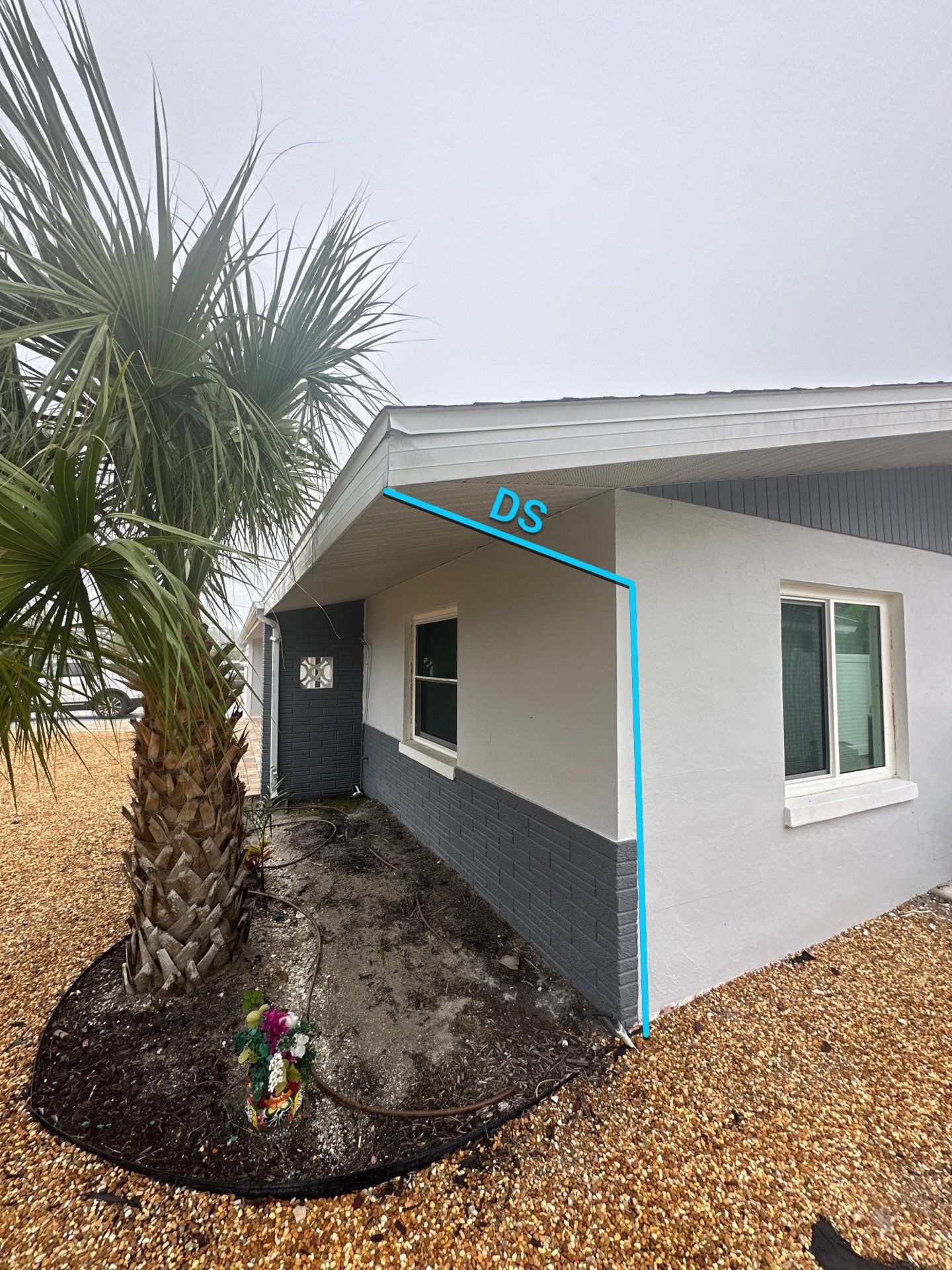 White Seamless Gutters with Matching Downspouts in Fort Myers Beach FL by Gutter Professors