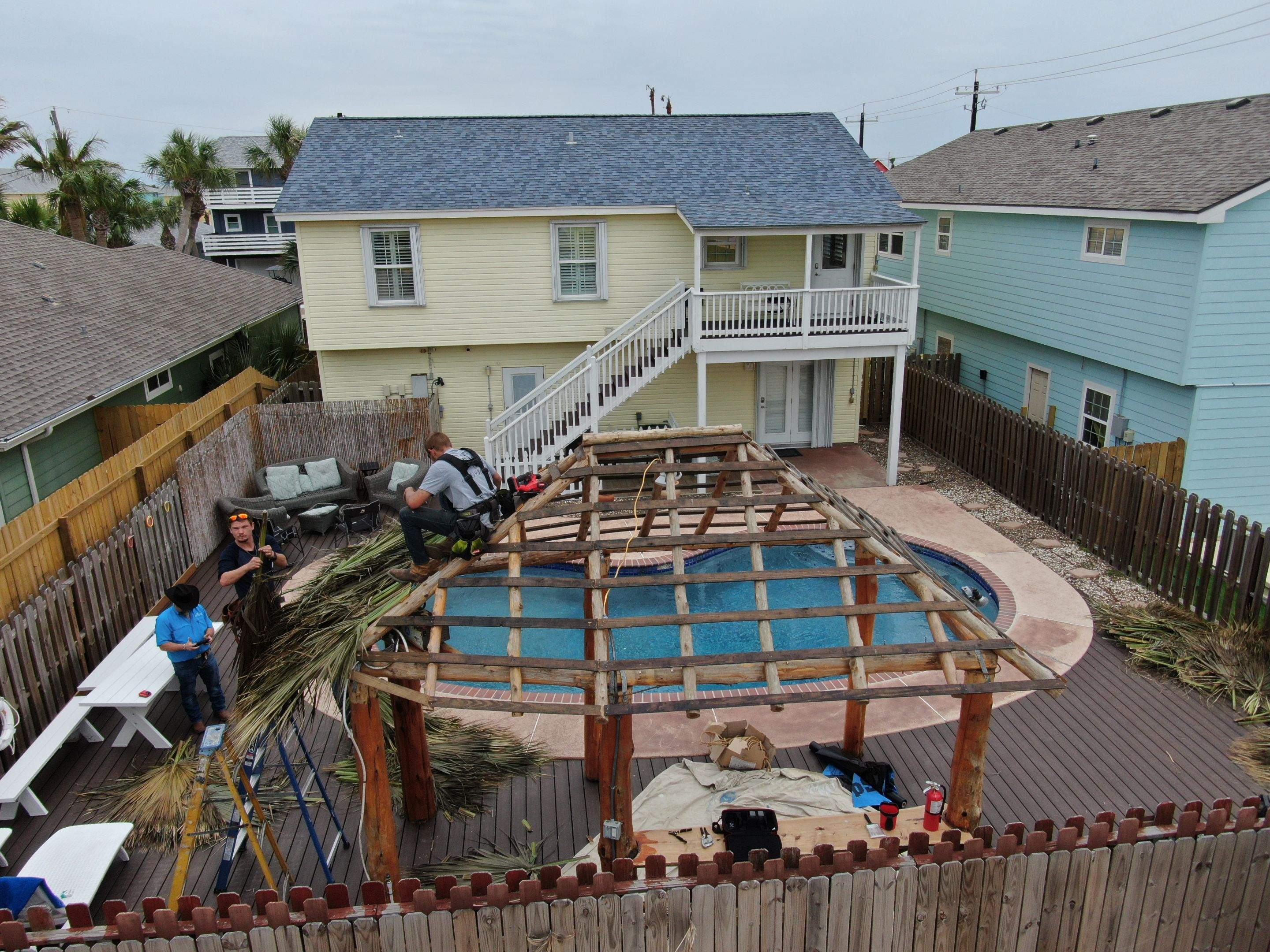 Poolside paradise by Bayfront Roofing and Construction