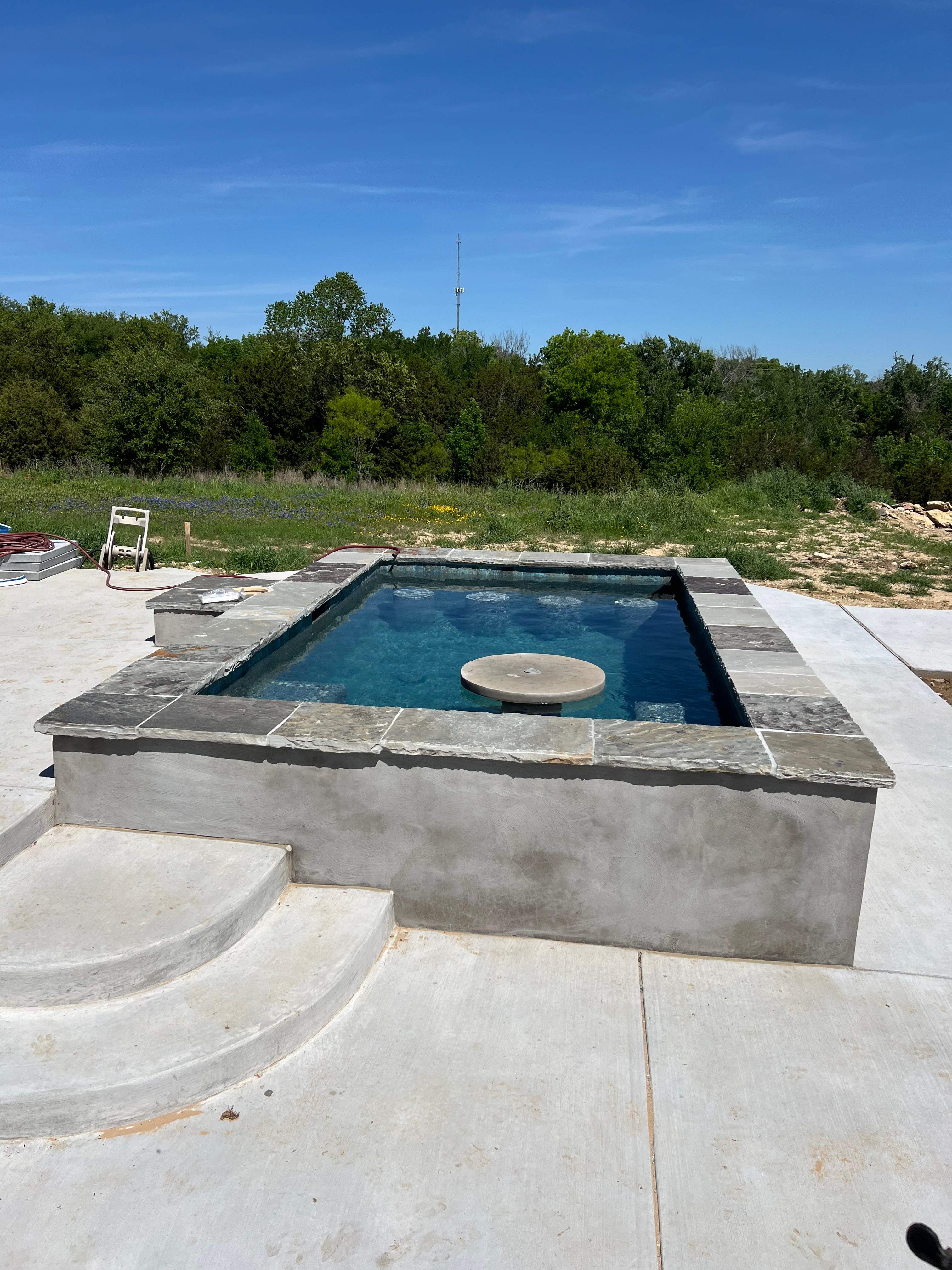Geometric Pool with Tanning Ledge and Fire Feature by Pinnacle Pools and Spas - DFW