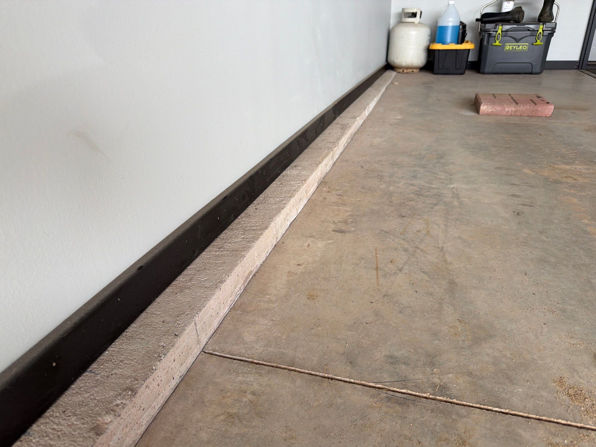 Custom Epoxy Garage Floor Coating Installation in Sioux Falls by Select Painting, Coatings & Garage Cabinets