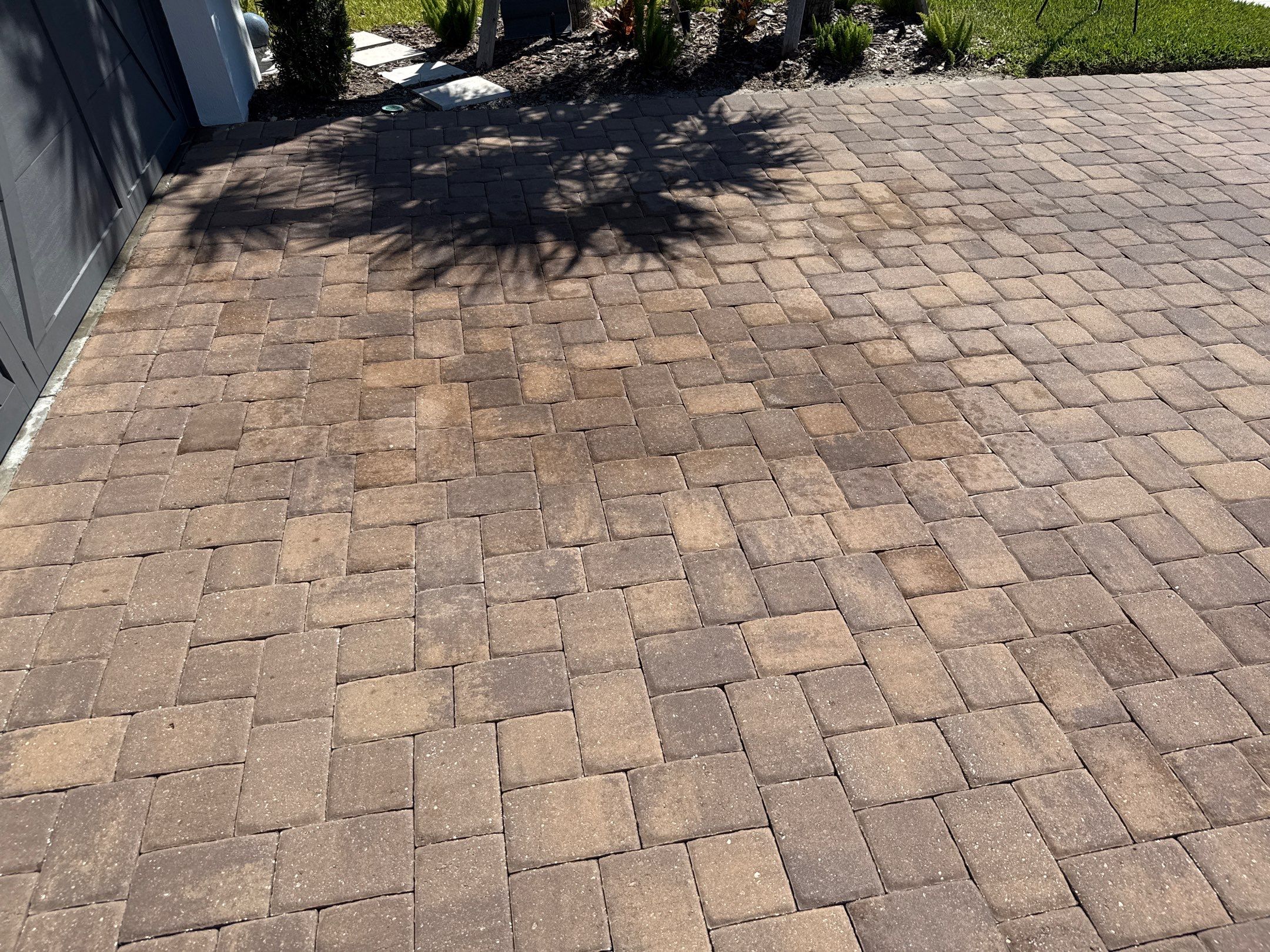 Oil Stain Removal on Paver Driveway | Esplanade at Artisan Lakes, Palmetto FL by Sunshine AquaWash