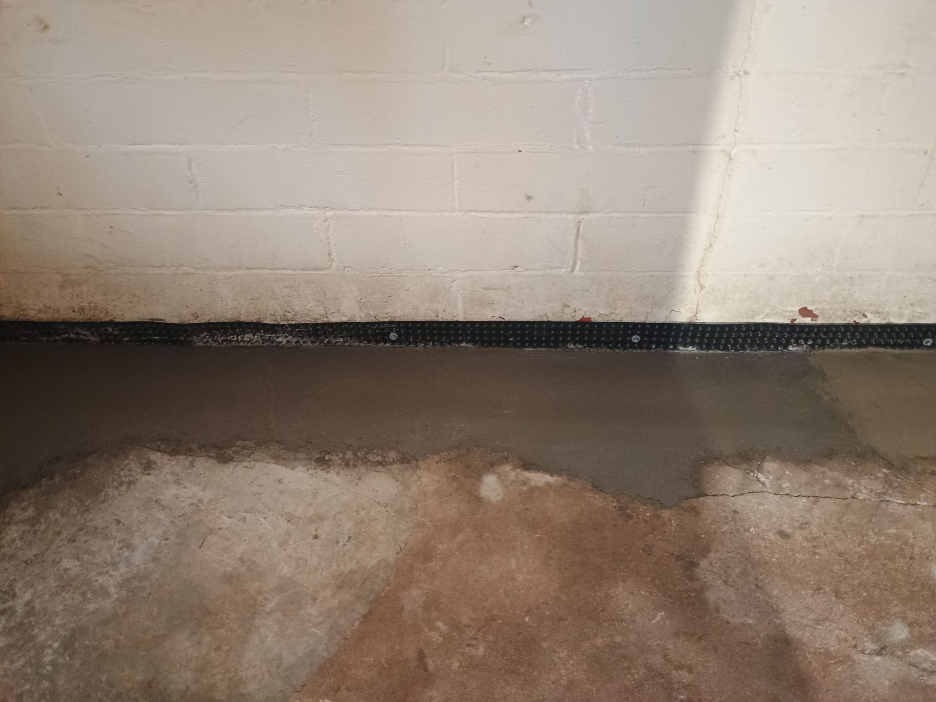Interior Drain Tile & Sump Pump System in North Minneapolis by Waterproofing Northeast