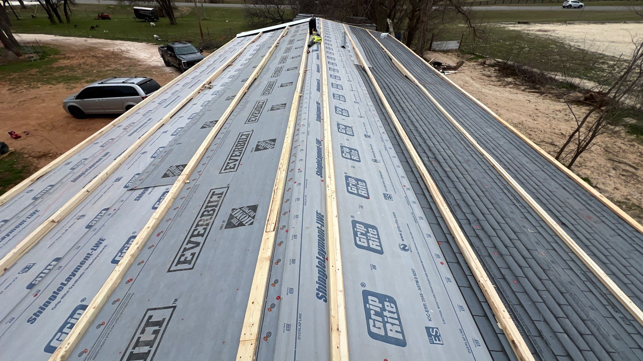 Residential Roofing Installation using PBR Metal Roof by Harvey Roofing & Construction