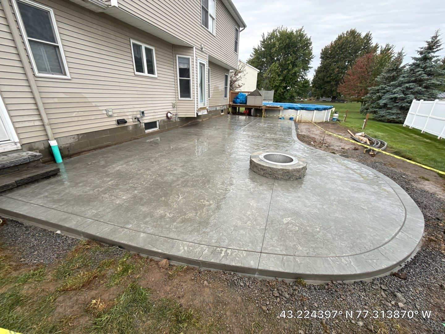Oxford slate stamped concrete patio  by NG Masonry & Construction LLC