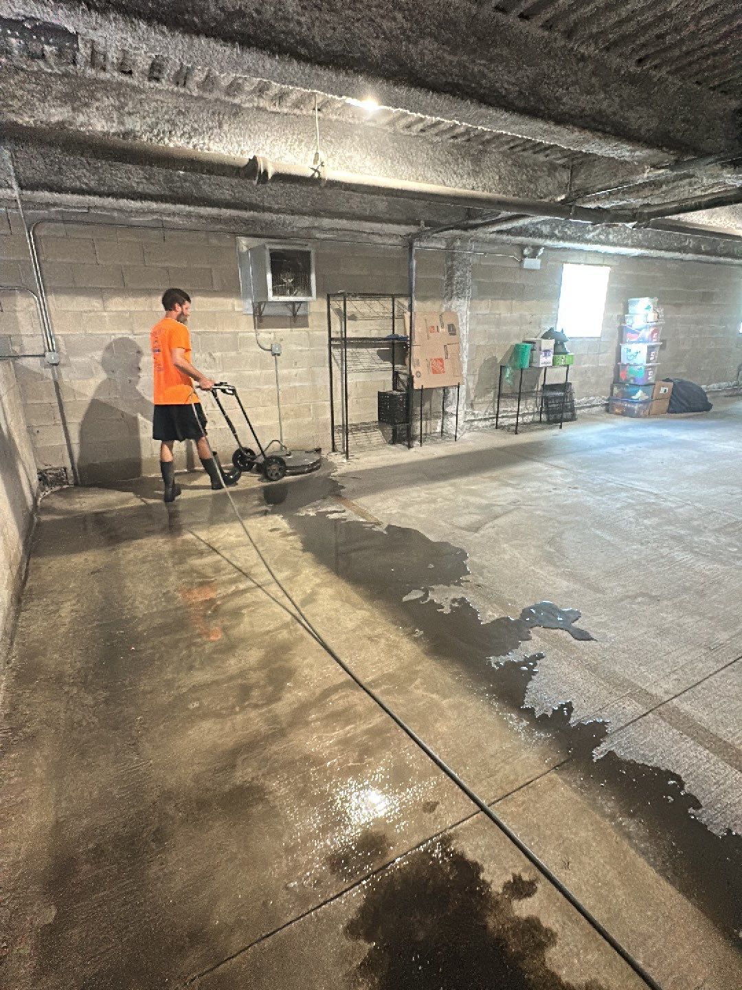 Parking garage using Hot water by Northern Power Washing LLC.