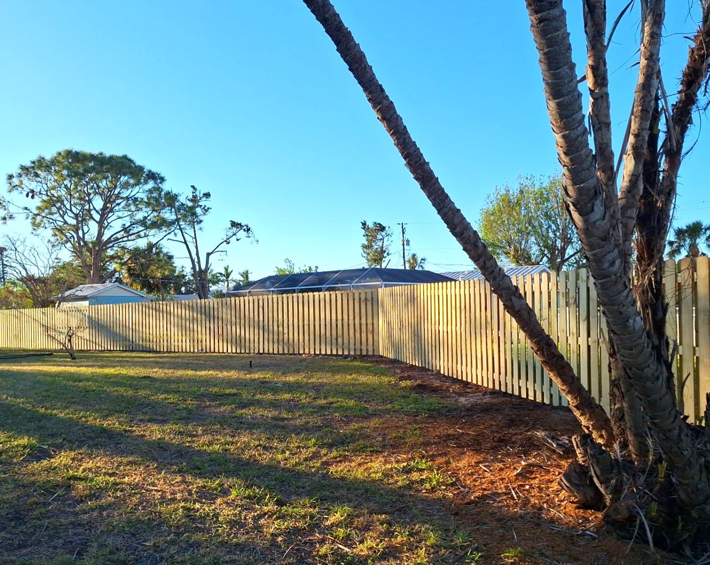 Wood Fence Installation using 6ft Pressure-Treated Wood Board-On-Board Privacy Fence with a 4Ft 3 Rail White Aluminum Fence by Asap fence and gates, LLC