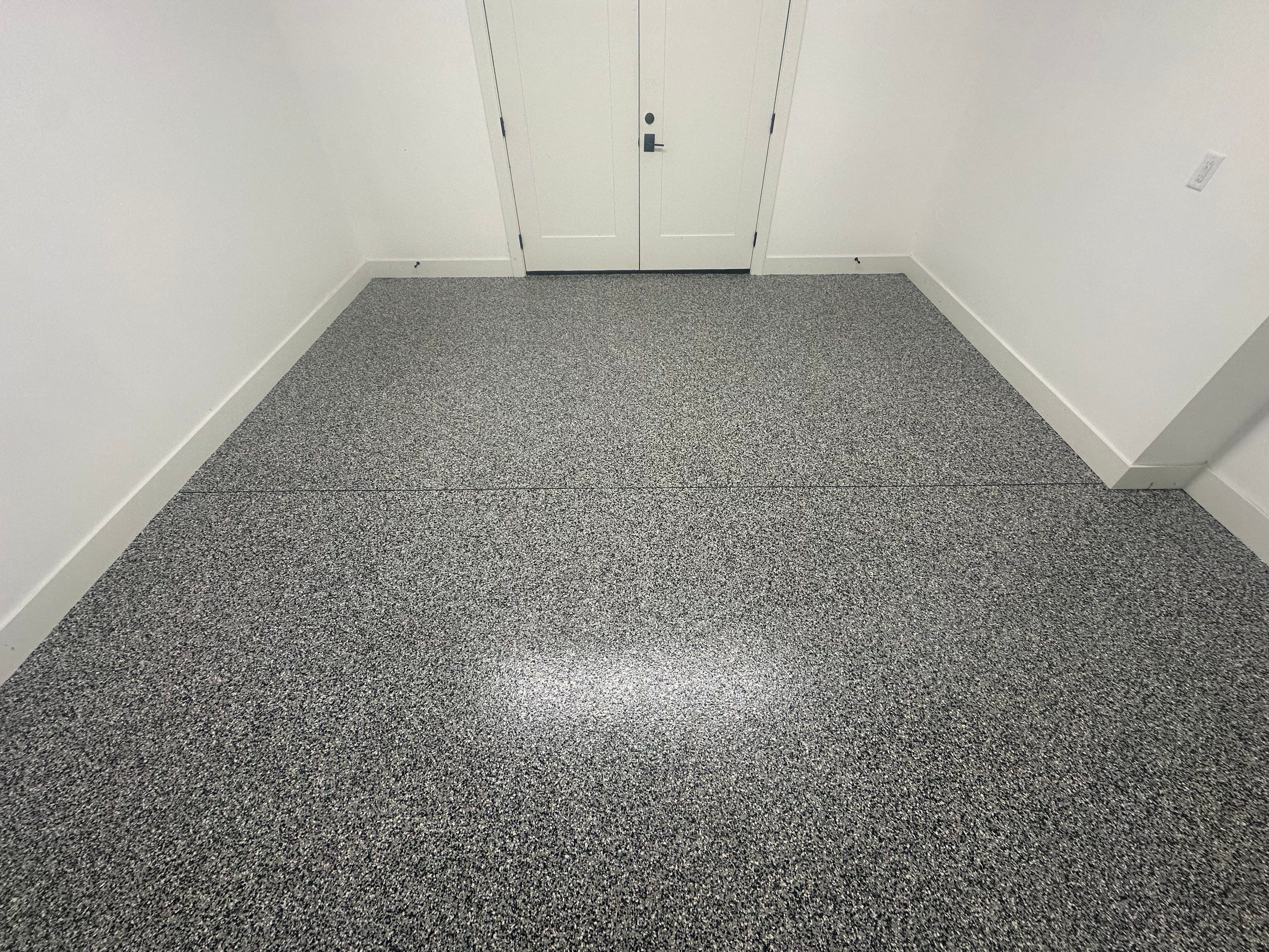 Multi-Color Epoxy Flake Garage Floor Installation in Sioux Falls by Select Painting, Coatings & Garage Cabinets