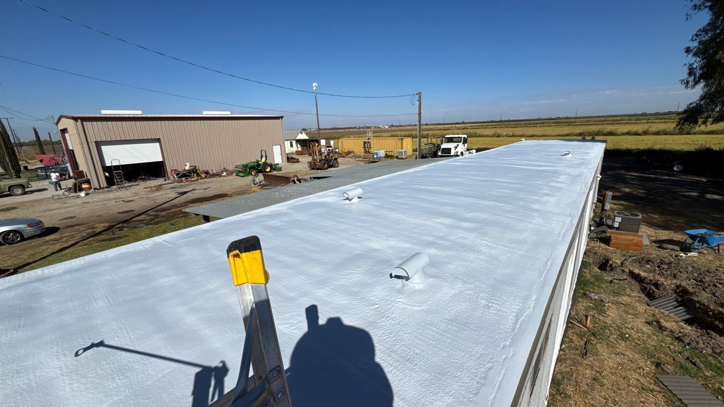 Foam and coatings on mobile home by Straight Edge Roofing Inc