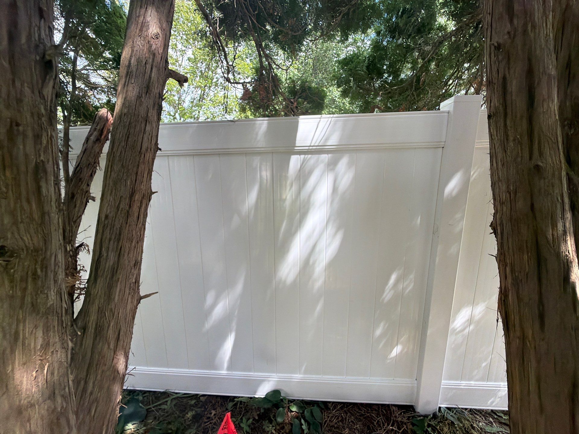 Residential White Vinyl Privacy and Black Chain Link Fencing in Jesup by Perfect Picket Fence and Stain
