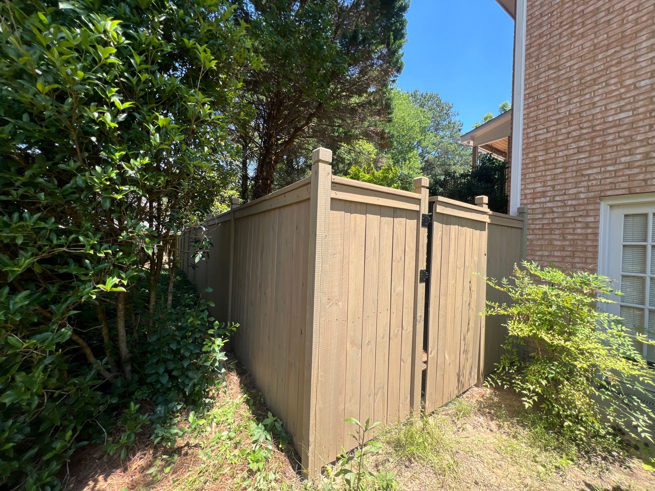 Pressure-Treated Wood Fence Installation and Deck Staining in Atlanta by Swift Home Renovations