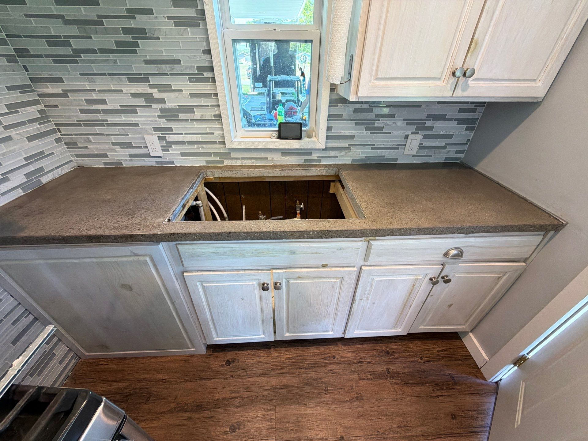 Custom Metallic Epoxy Floor and Polished Countertop Installation in Mears by Gordon Painting