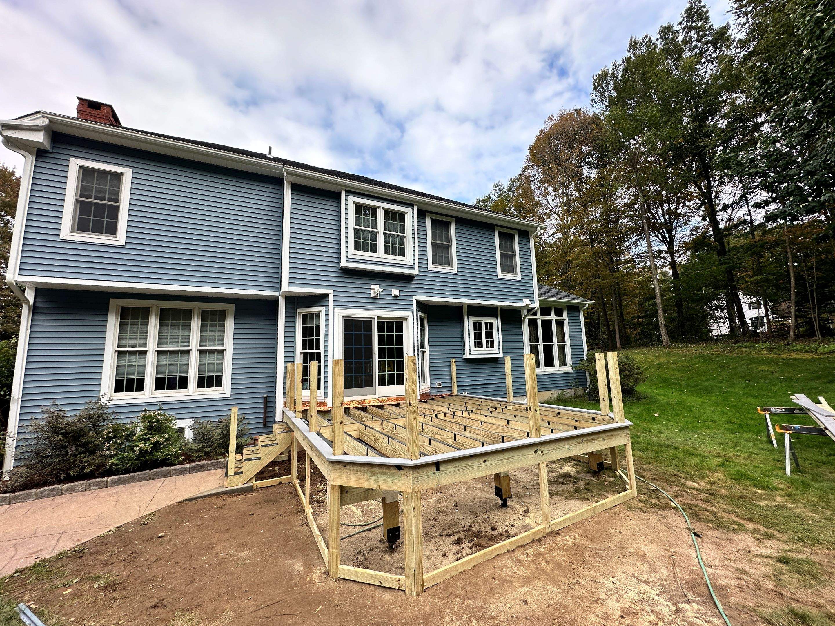 Deck replacement using Trex lineage Rainier with angled edges, Transcend cocktail rail and lattice. by DiGiorgi Roofing and Siding Inc