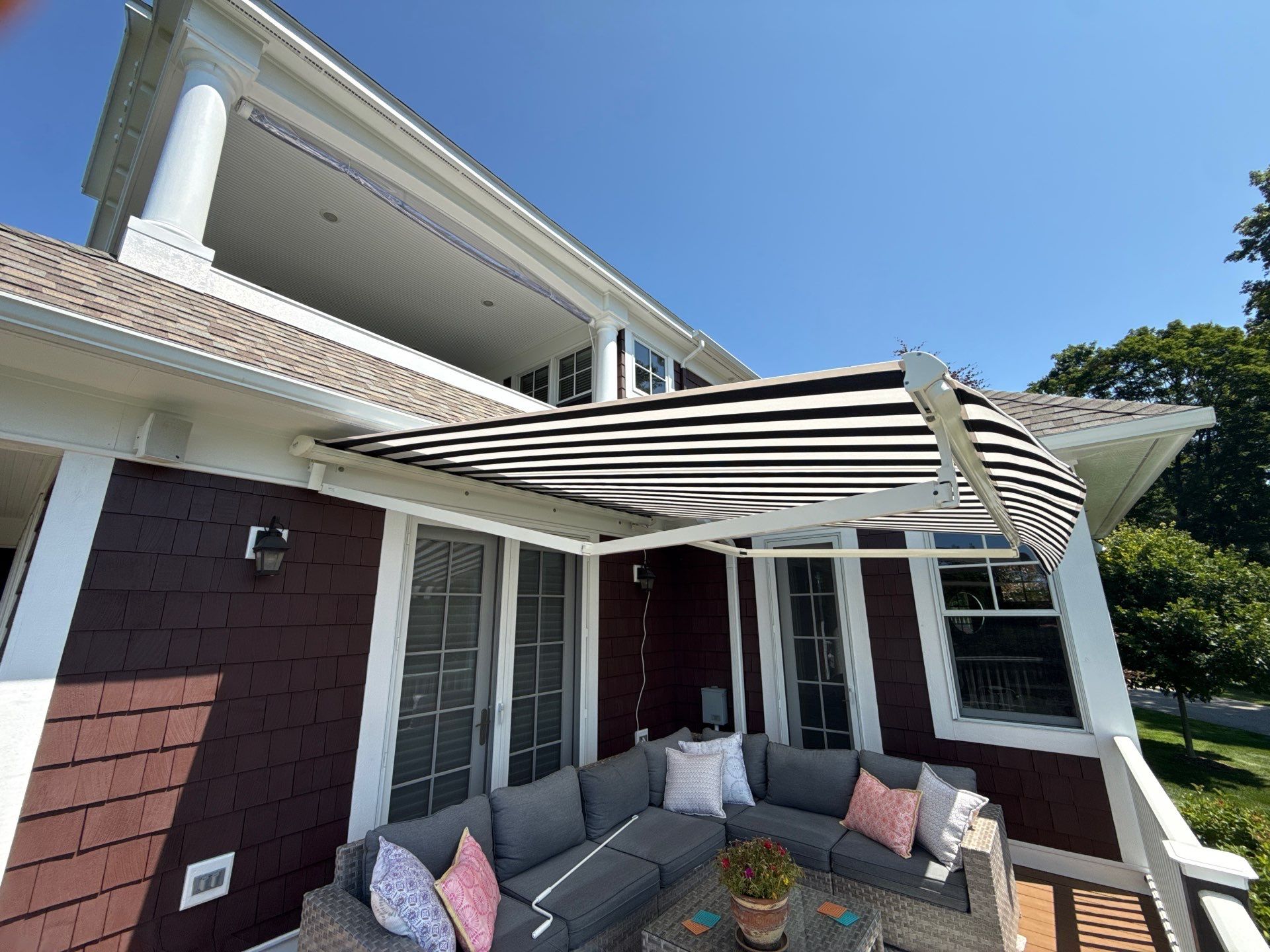 Sunesta Retractable Awning Installation in Harbor Springs by Rainbow Seamless Systems