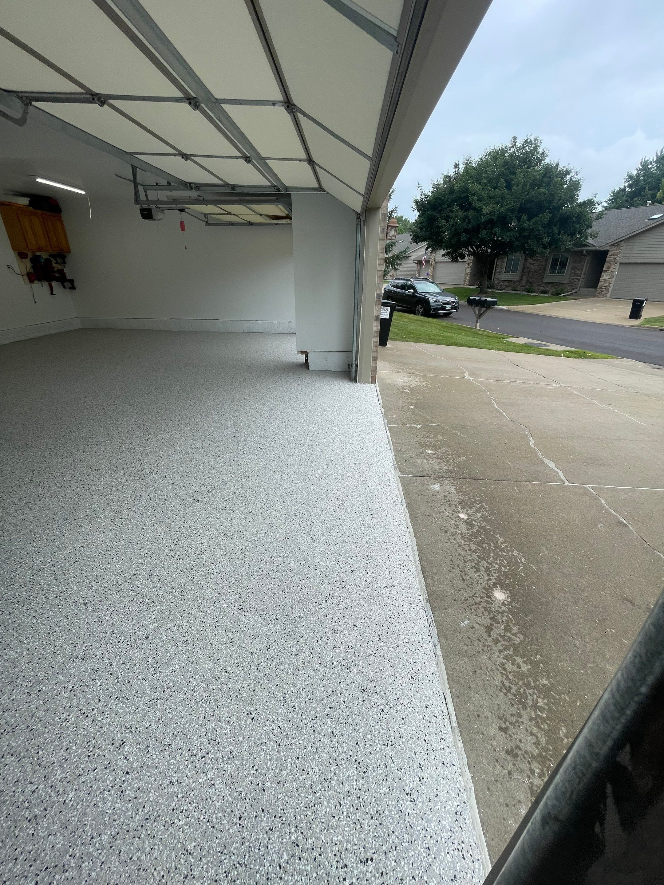 Cabin Fever Garage Floor System in Sioux Falls by Select Painting, Coatings & Garage Cabinets