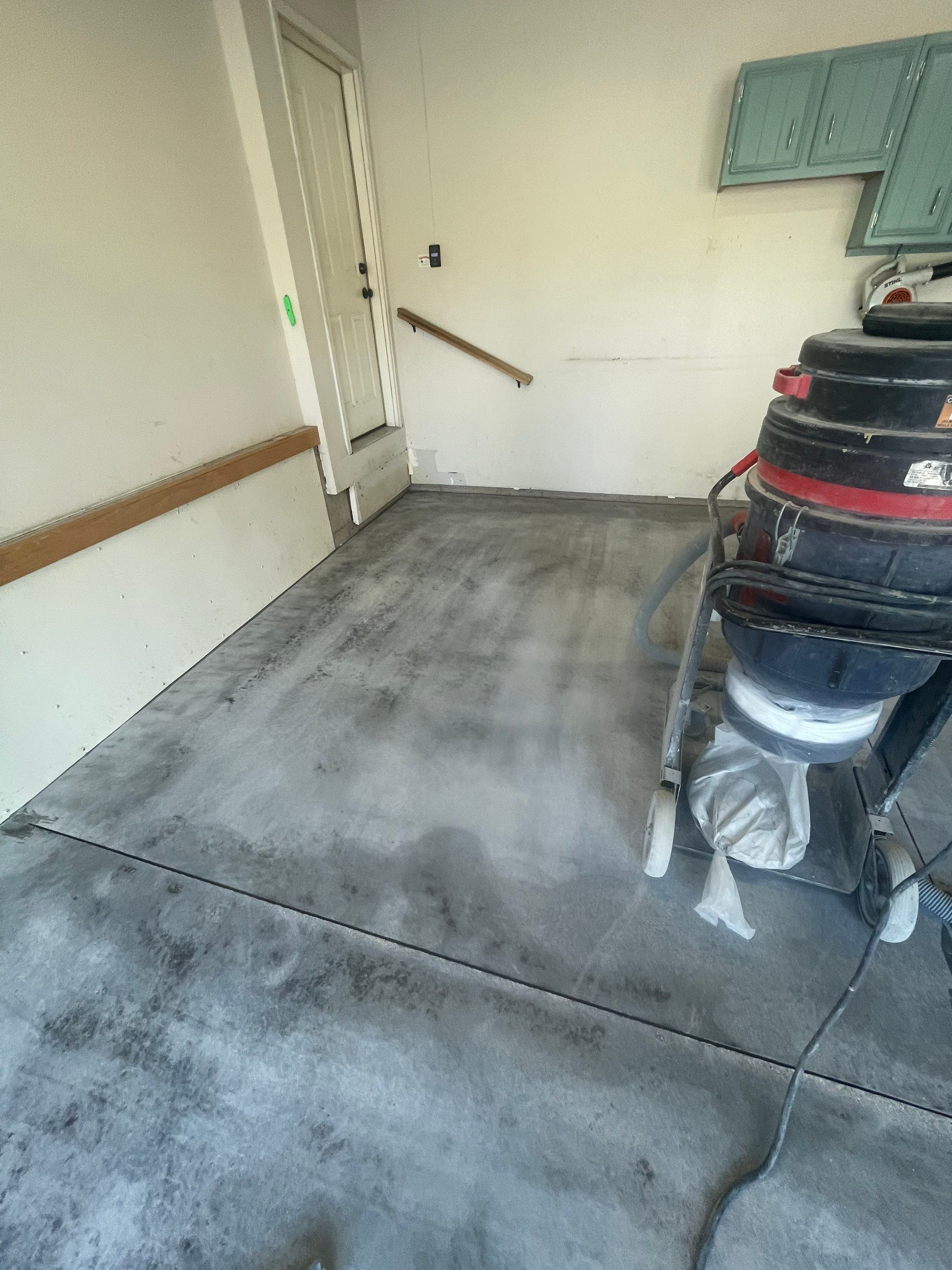 Multi-Stall Garage Floor Coating Installation in Sioux Falls by Select Painting, Coatings & Garage Cabinets