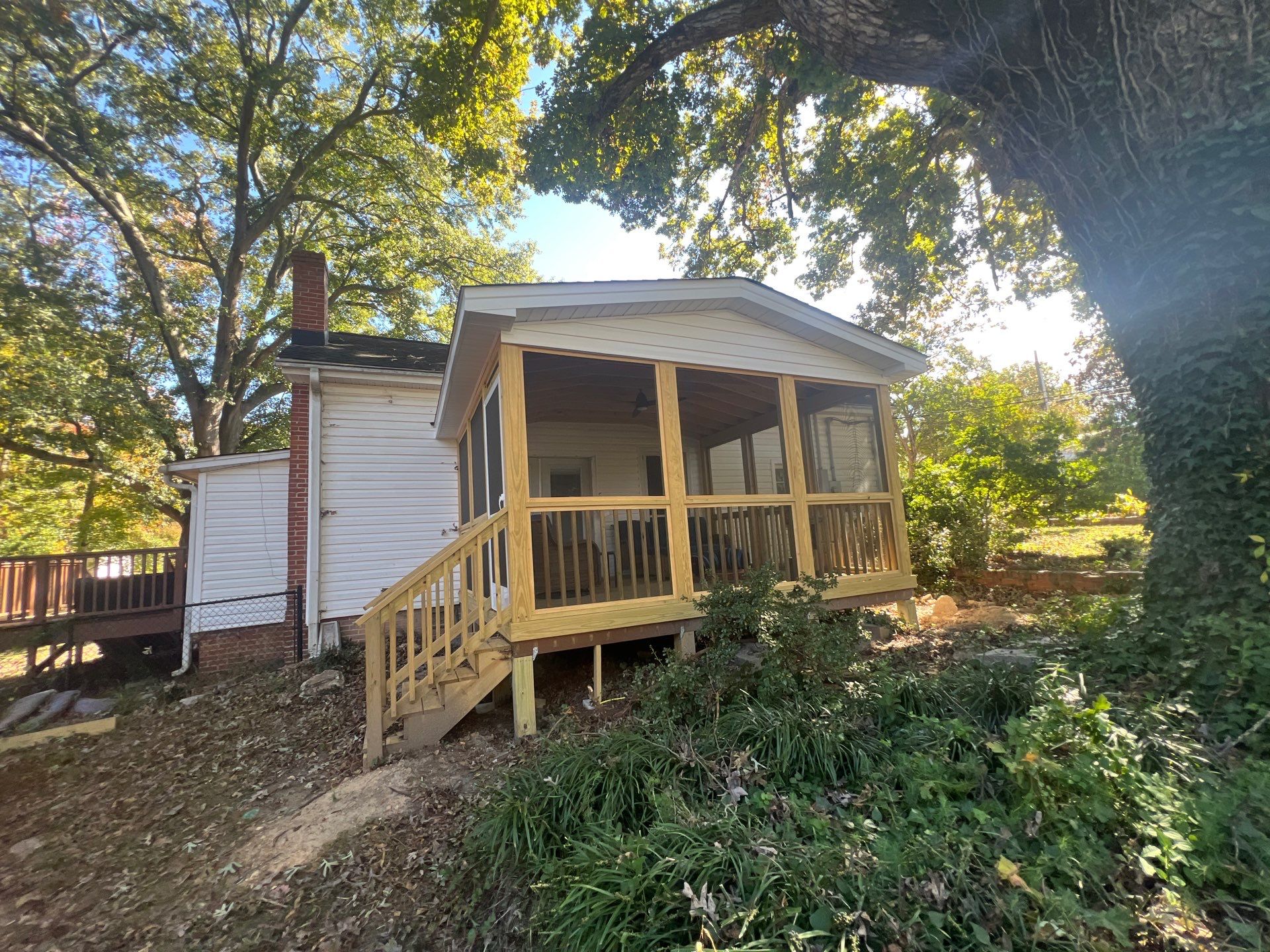 Custom Screened Porch Construction with Gable Roof in Apex by The Remodeling Company