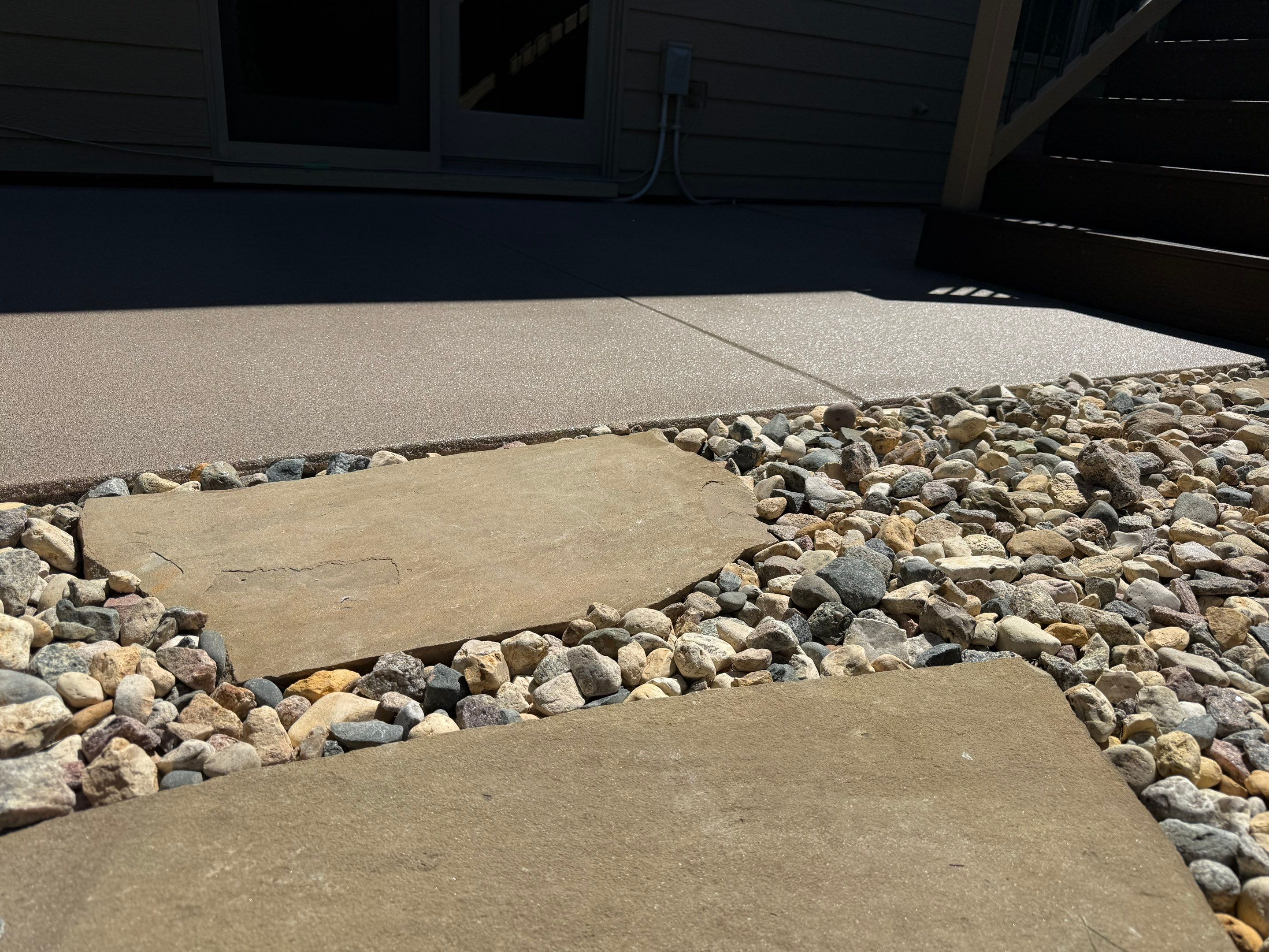 Textured Concrete Coating and Paver Patio Refresh in Sioux Falls by Select Painting, Coatings & Garage Cabinets