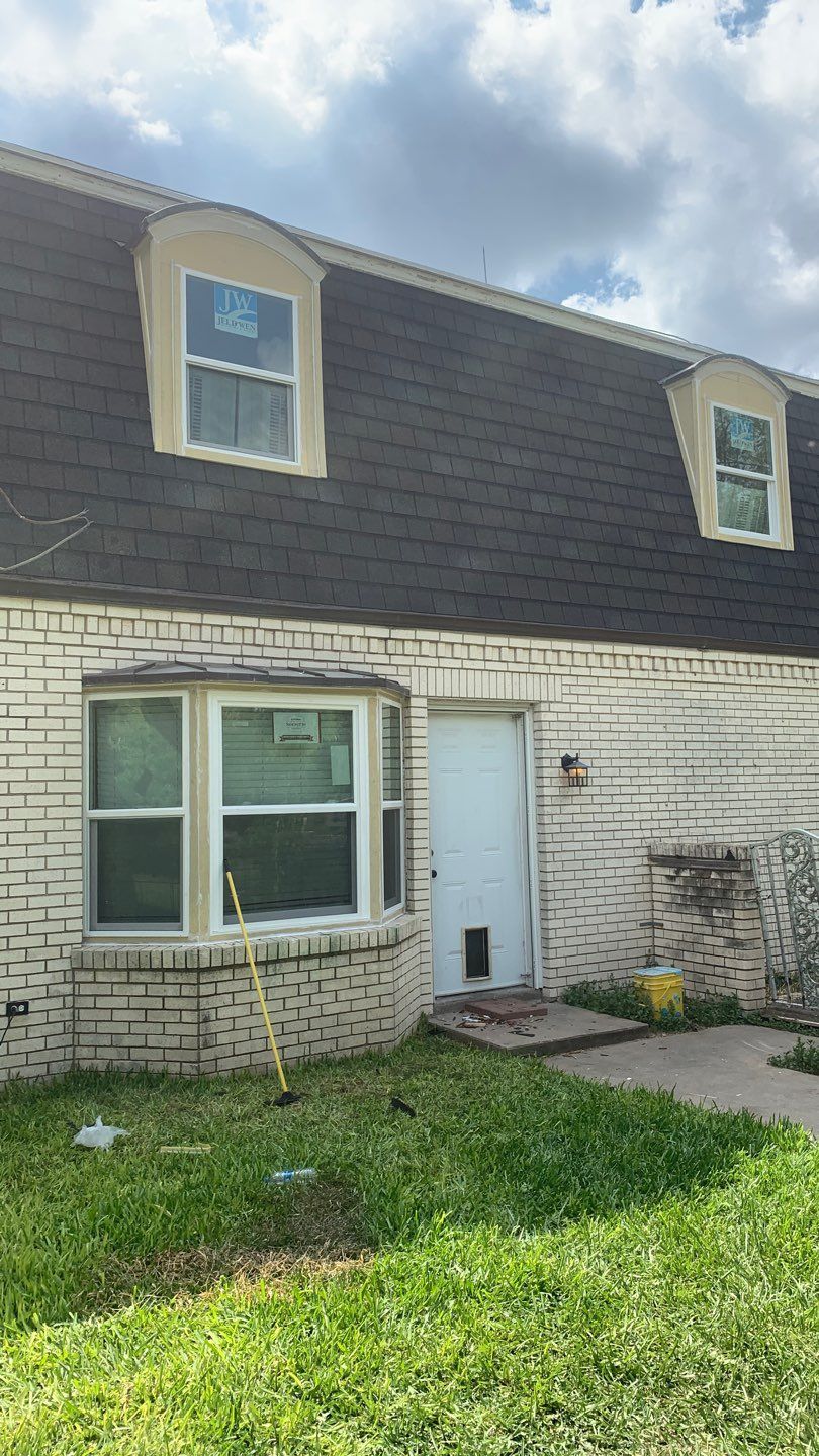 Mansard Charm by Bayfront Roofing and Construction