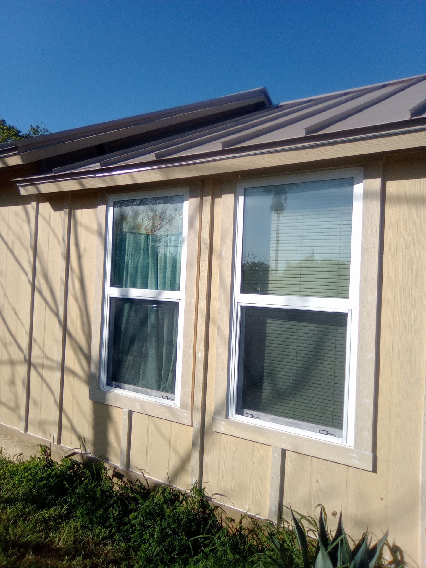 Vinyl to Hardie by Bayfront Roofing and Construction