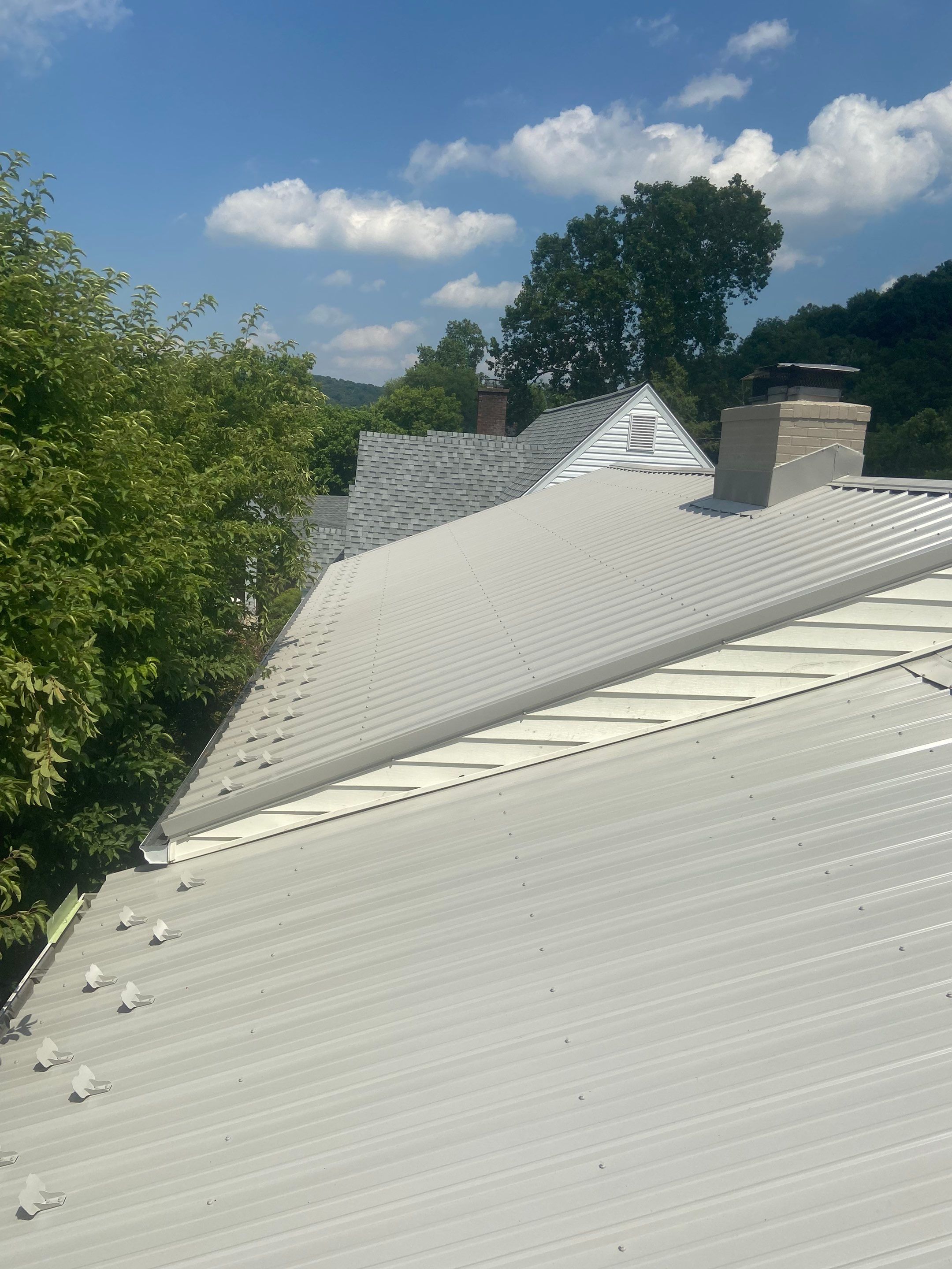 Metal Roofing, Skylights, Porch Build by Secure Construction Company Inc